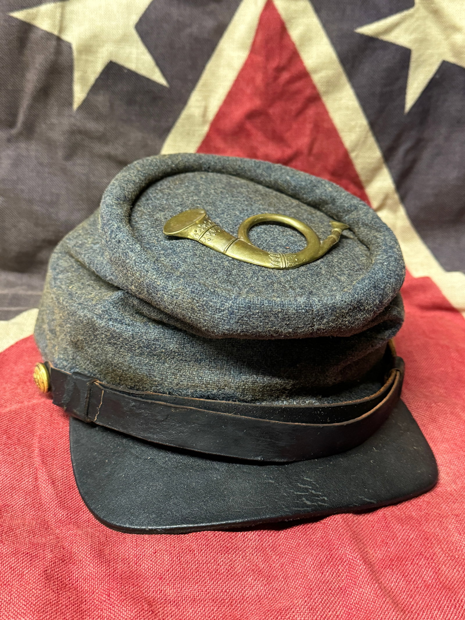 RARE CIVIL WAR CONFEDERATE CSA INFANTRY KEPI HAT CAP WITH C.S. BUTTONS: RARE CIVIL WAR CONFEDERATE CSA INFANTRY KEPI WITH C.S. BUTTONS. A VERY RARE KEPI THAT IS IN MINT OVERALL SHAPE AND CONDIITON WITH A BEAUTIFUL OVERALL PATINA. HAS THE C.S. WITH EAGLE BUTTONS ATTACHED T