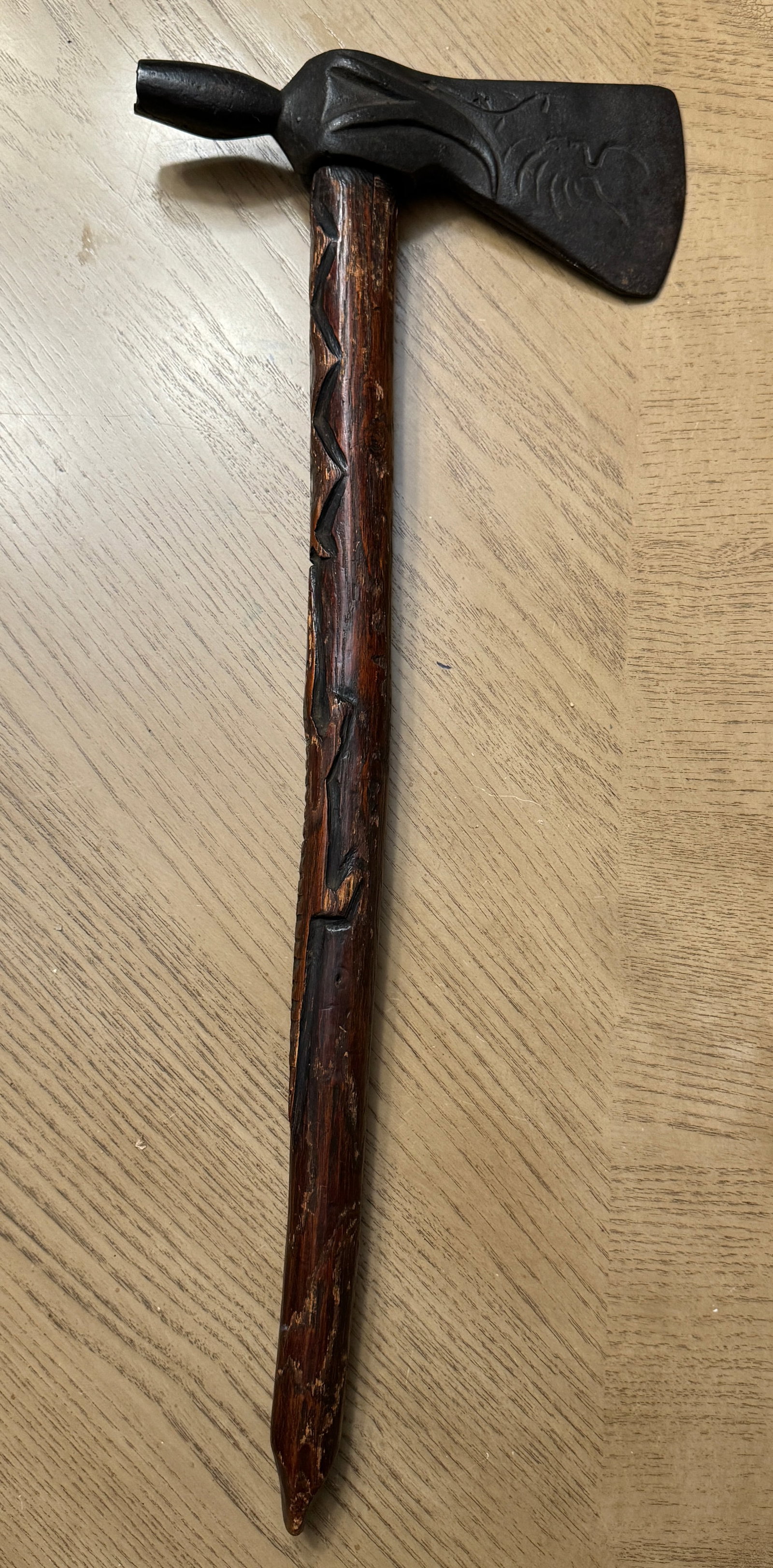 1800'S NATIVE AMERICAN INDIAN ENGRAVED BLADE & HANDLE TOMAHAWK HUNTING AXE: 1800'S NATIVE AMERICAN INDIAN ENGRAVED BLADE & HANDLE TOMAHAWK HUNTING AXE. ONE OF THE NICEST TOMAHAWK'S YOU'LL OWN. THE BLADE IS ENGRAVED DEPICTING A NATIVE AMERICAN INDIAN ON ONE SIDE AND AN HAND EN