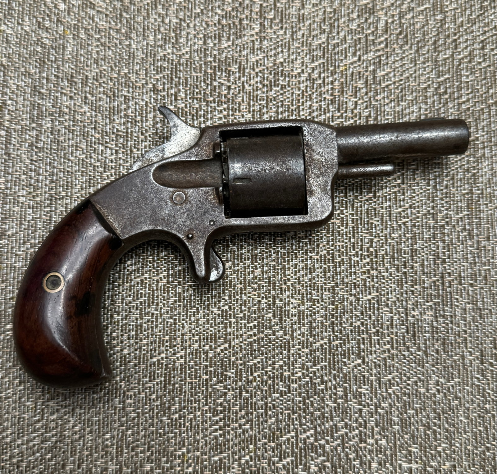 1880'S AN AMERICAN VOLUNTEER .32 RIM-FIRE 5 SHOT REVOLVER: 1880'S AN AMERICAN VOLUNTEER .32 RIM-FIRE 5 SHOT REVOLVER. A RARE FIND. a good example of an early spur trigger revolver. Circa 1880. Plain wooden two piece grips. Marked on top of the 2.5 inch barrel