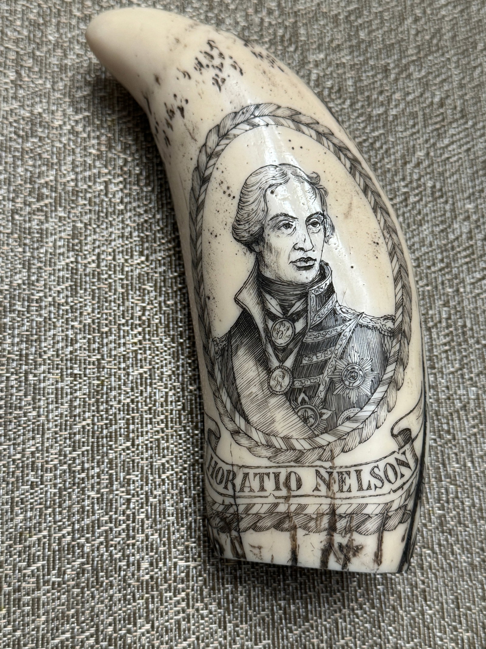 ANTIQUE H.M.S. VICTORY HORATIO NELSON ENGRAVED TOOTH SCRIMSHAW: ANTIQUE H.M.S. VICTORY HORATIO NELSON ENGRAVED TOOTH SCRIMSHAW. IN MINT OVERALL SHAPE AND CONDITION WITH A BEAUTIFUL OVERALL PATINA. PLEASE VIEW ALL DETAILED PICTURES. A GREAT FIND AND AN EXCELLENT AD