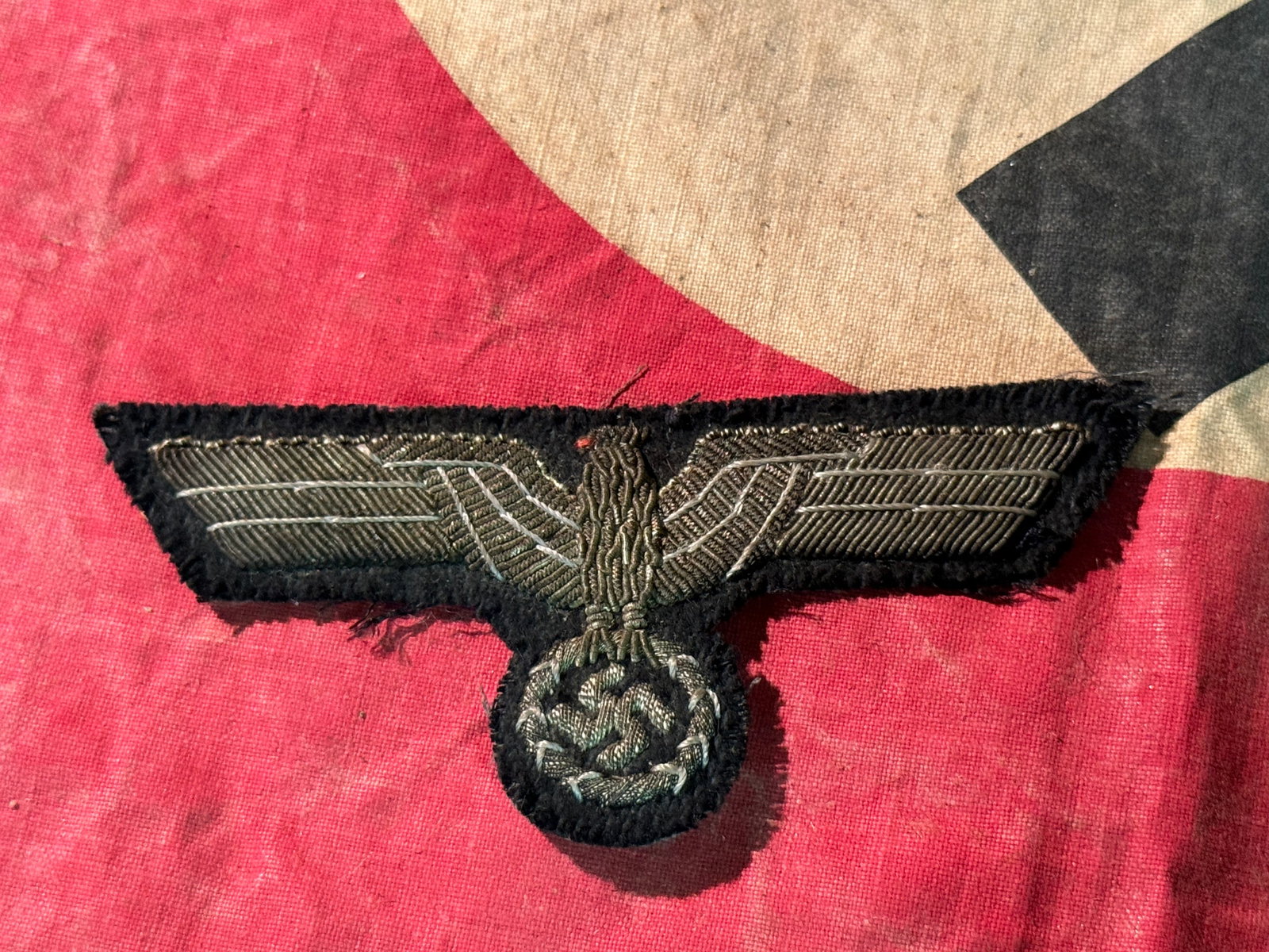 WW2 German Army (Heer) Officer’s Embroidered Breast Eagle: WW2 German Army (Heer) Officer’s Embroidered Breast Eagle. Silver bullion embroidered breast eagle with out-stretched wings, clutching a wreathed, canted, swastika in its talons. Please view all det