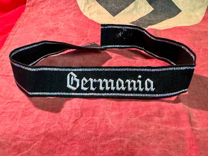 RARE WW2 GERMAN GERMANIA SCRIPT CUFF TITLE: RARE WW2 GERMAN GERMANIA SCRIPT CUFF TITLE. A RARE FIND. IT IS IN MINT OVERALL SHAPE AND CONDITION WITH A BEAUTIFUL OVERALL PATINA. SHOWS GOOD WEAR AND USE. A WELL MADE ANTIQUE GERMAN ARTIFACT.