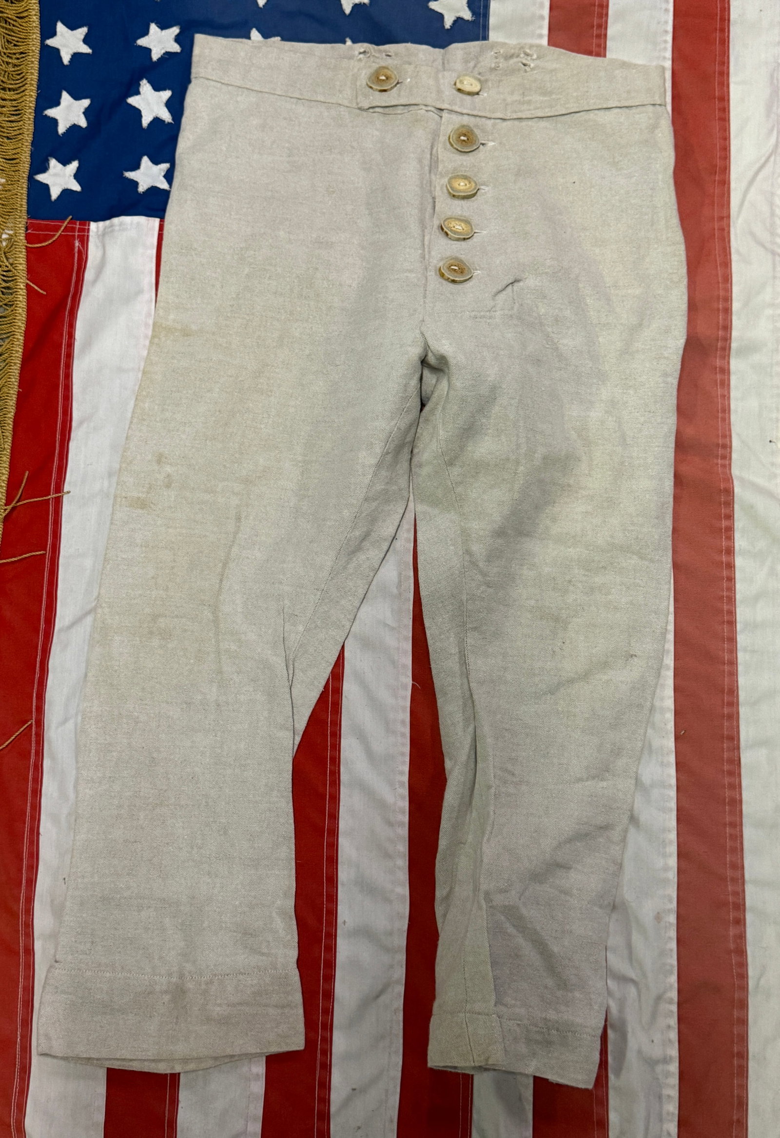 VERY RARE REVOLUTIONARY WAR SOLDIERS PANTS: VERY RARE REVOLUTIONARY WAR SOLDIERS PANTS. ALL HAND-STITCHED WITH BONE BUTTONS. SHOWS GOOD WEAR AND USE WITH A BEAUTIFUL PATINA THROUGHOUT. A GREAT FIND AND AN EXCELLENT ADDITION TO YOUR COLLECTION.