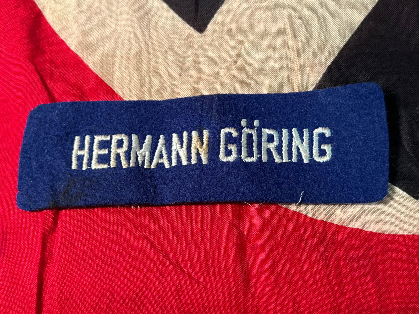 RARE WW2 GERMAN HERMANN GORING CLOTH TAG FOR A UNIFORM: RARE WW2 GERMAN HERMANN GORING CLOTH TAG FOR A UNIFORM. A VERY RARE FIND. IT IS IN MINT OVERALL SHAPE AND CONDITION WITH A BEAUTIFUL OVERALL PATINA. SHOWS GOOD WEAR AND USE. VERY WELL MADE. A RARE ART