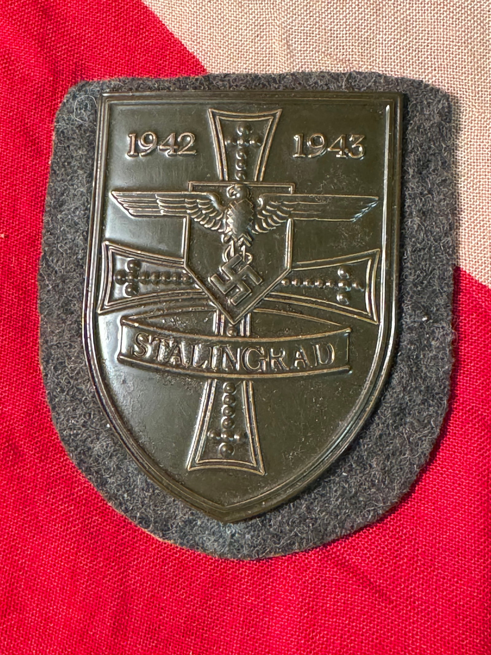 WW2 German "Stalingrad 1942-1943" Battle Shield: WW2 German "Stalingrad 1942-1943" Battle Shield. A VERY RARE FIND. IT IS IN MINT OVERALL SHAPE AND CONDITION WITH A BEAUTIFUL OVERALL PATINA. SHOWS GOOD WEAR AND USE. VERY WELL MADE. A RARE ARTIFACT.