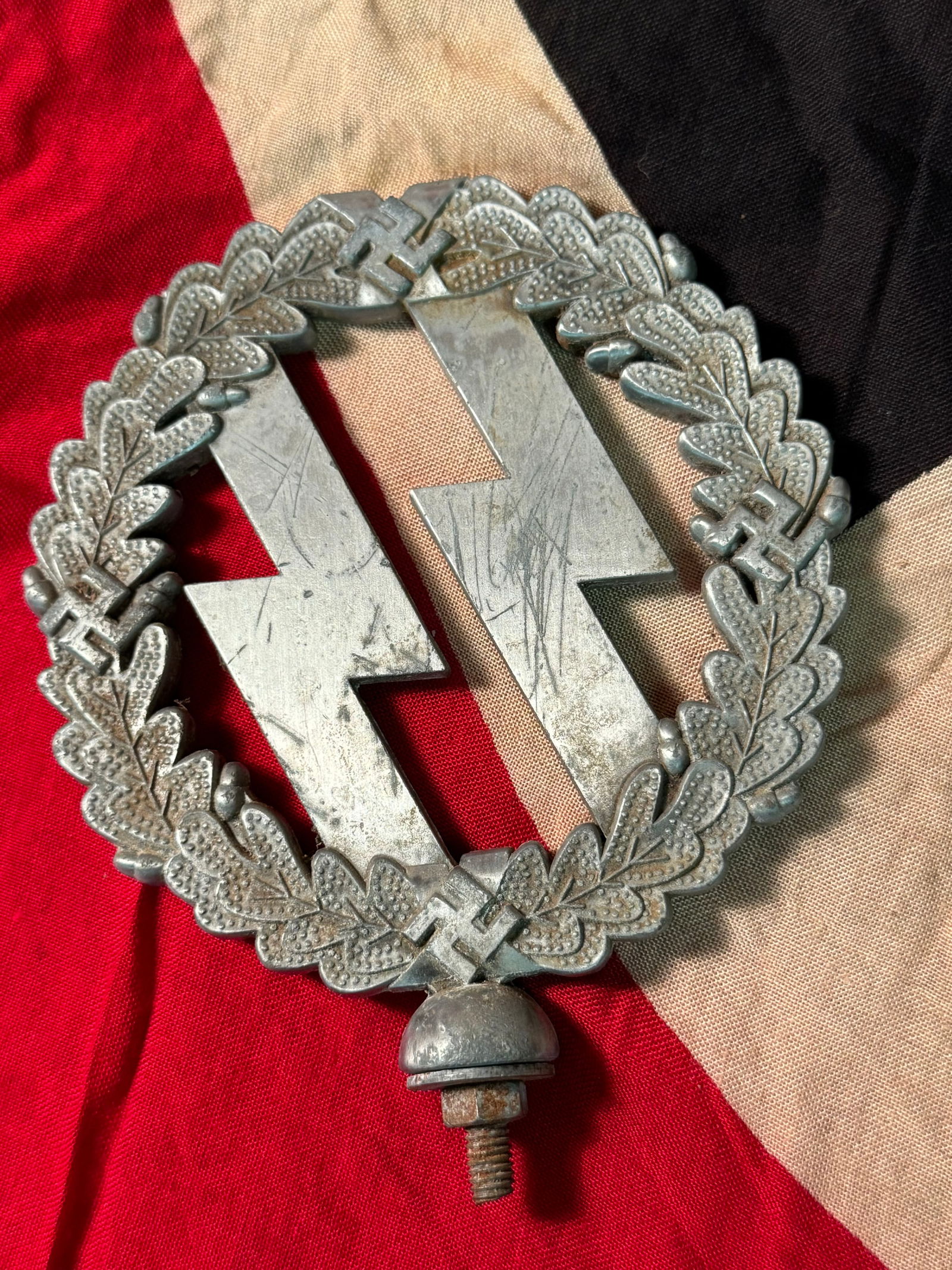 VET BRING BACK WW2 GERMAN WAFFEN SS FLAG POLE TOP: VET BRING BACK WW2 GERMAN WAFFEN SS FLAG POLE TOP. A VERY RARE FIND. WAS BROUGHT BACK HOME BY A VET. SHOWS GOOD WEAR AND USE WITH A BEAUTIFUL PATINA THROUGHOUT. PLEASE VIEW ALL DETAILED PICTURES. A RA