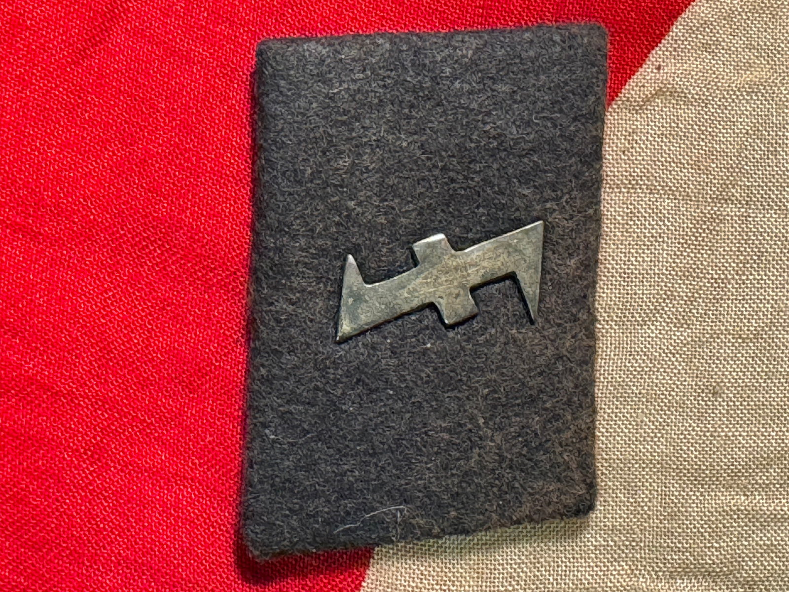 WW2 German Waffen SS Nederland NCO Collar Tab: WW2 German Waffen SS Nederland NCO Collar Tab. A rare find. Fine black wool backing, tight silver bullion embroidery exhibits a few spots of oxidation.