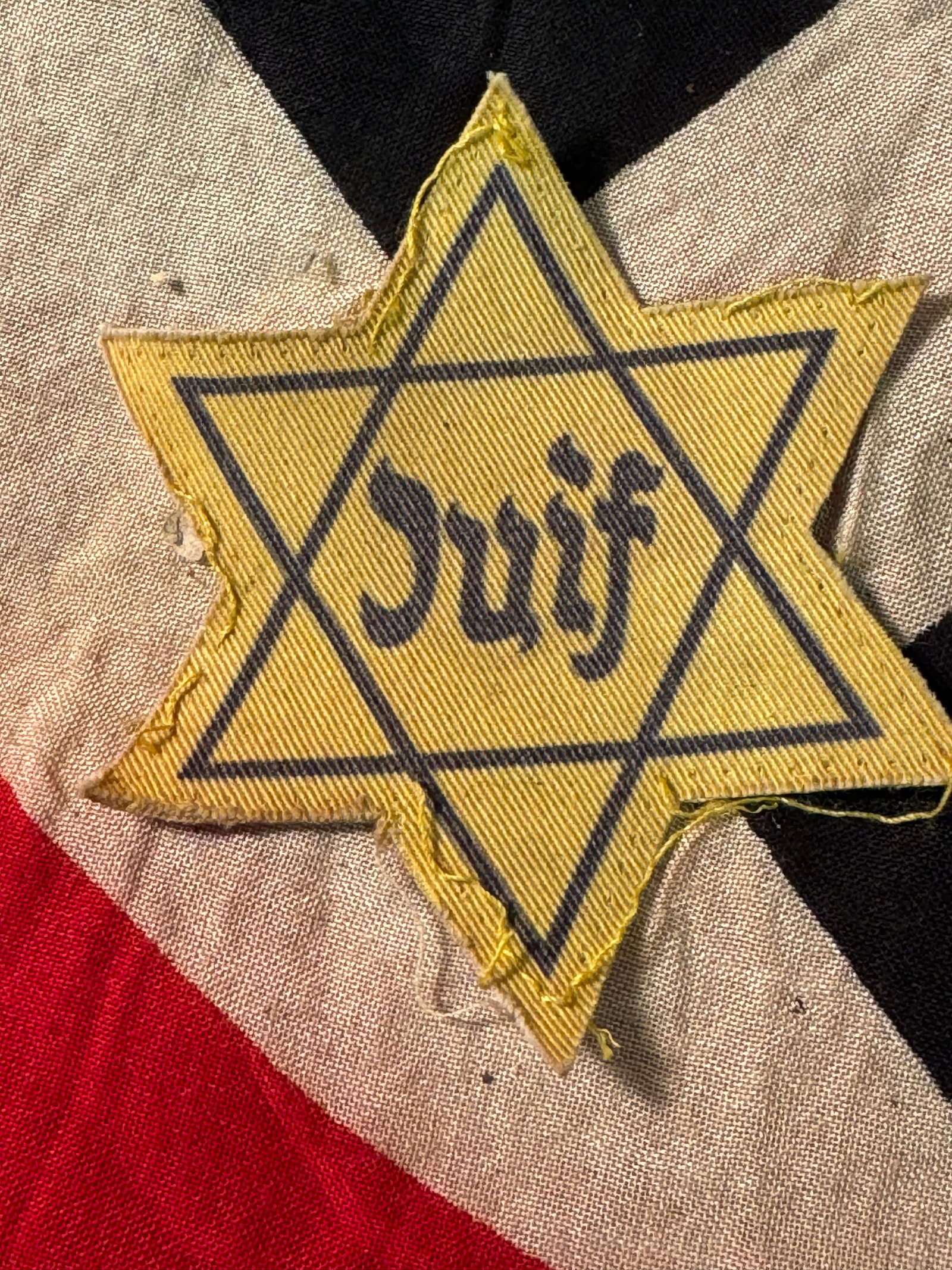 RARE WW2 GERMAN FRENCH JUIF STAR OF DAVID CLOTH BADGE INSIGNIA: RARE WW2 GERMAN FRENCH JUIF STAR OF DAVID CLOTH BADGE INSIGNIA. In Belgium the decree forcing Jewish people to wear identifiers was issued on May 27, 1942 to come into force on June 3, 1942. The decre