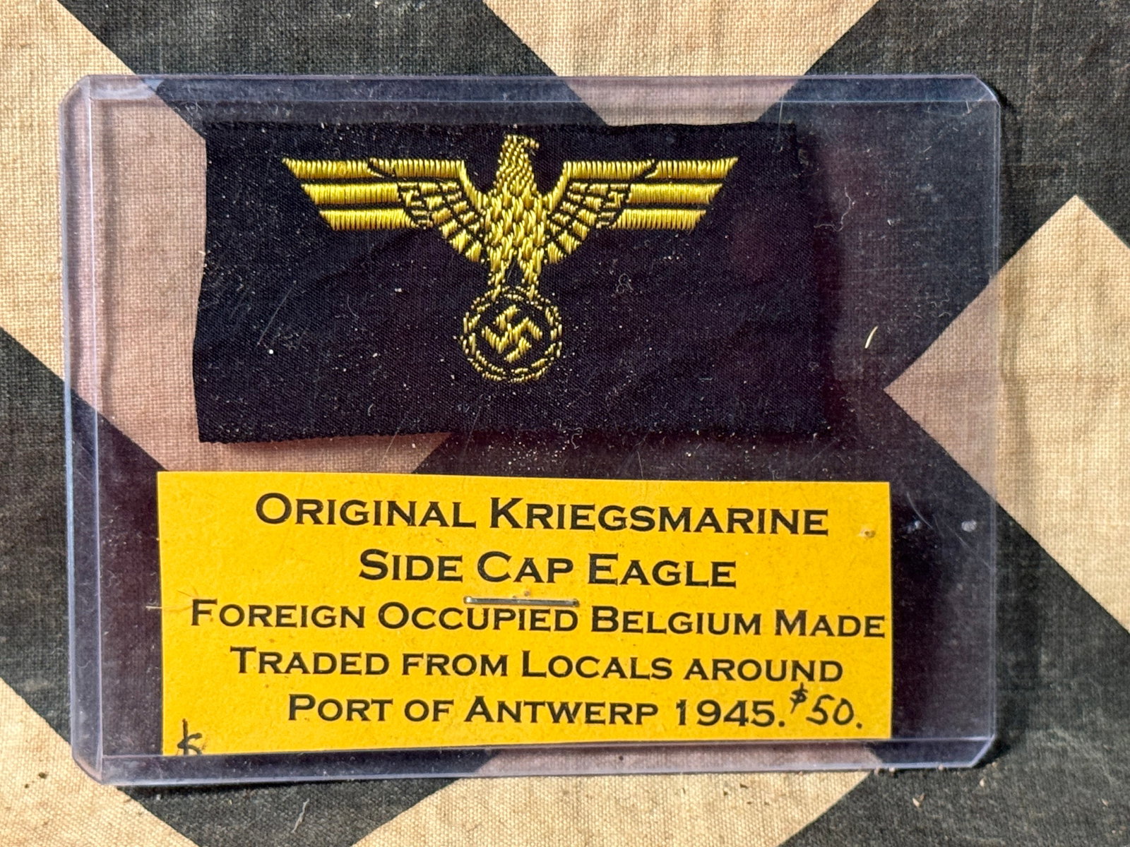ORIGINAL WW2 GERMAN KRIEGSMARINE SIDE CAP EAGLE: ORIGINAL WW2 GERMAN KRIEGSMARINE SIDE CAP EAGLE. FOREIGN OCCUPIED BELGIUM MADE TRADED FROM LOCALS AROUND PORT OF ANTWERP 1945.