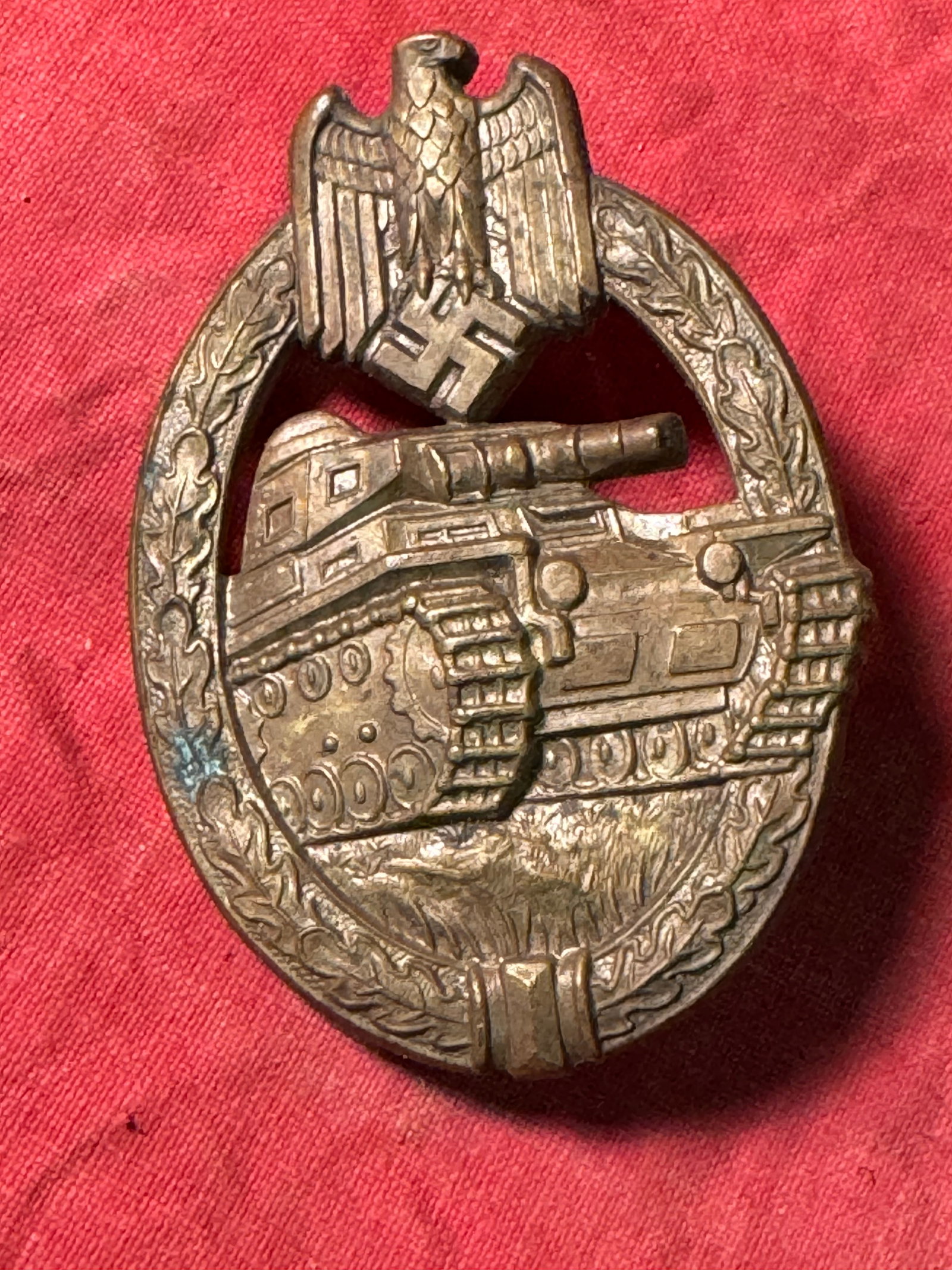 WW2 GERMAN BRONZE PANZER ASSAULT BADGE BY RUDOLF SOUVAL: WW2 GERMAN BRONZE PANZER ASSAULT BADGE BY RUDOLF SOUVAL. A VERY RARE EXAMPLE. SHOWS GOOD WEAR AND USE WITH A BEAUTIFUL OVERALL PATINA. PLEASE VIEW ALL DETAILED PICTURES. A WELL MADE ANTIQUE GERMAN ART