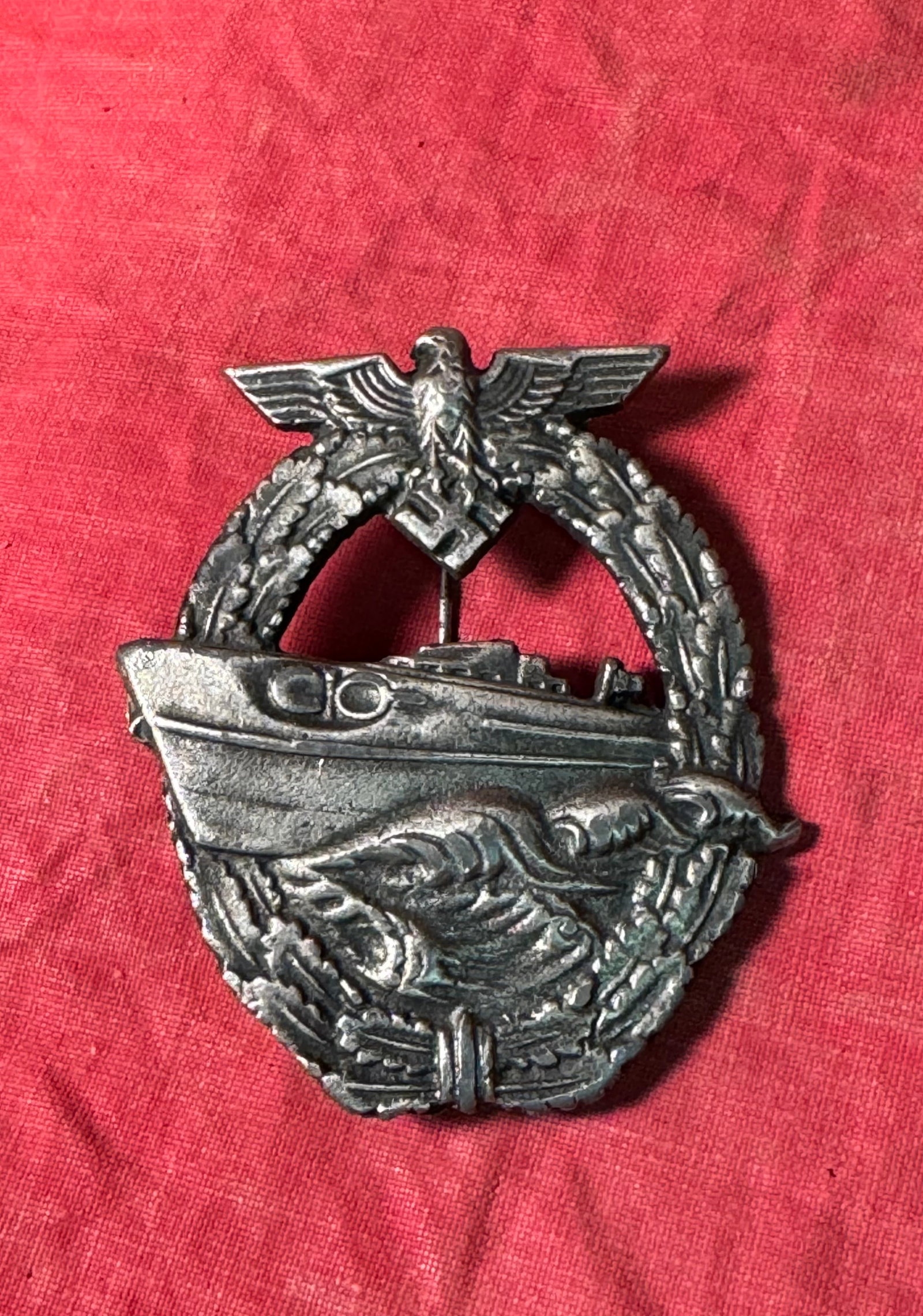 RARE WW2 GERMAN E-BOAT BADGE WITH MAKER MARKS: RARE WW2 GERMAN E-BOAT BADGE WITH MAKER MARKS. A SCARCE ITEM. SHOWS GOOD WEAR AND USE WITH A BEAUTIFUL OVERALL PATINA. PLEASE VIEW ALL DETAILED PICTURES. A WELL MADE ANTIQUE GERMAN ARTIFACT.