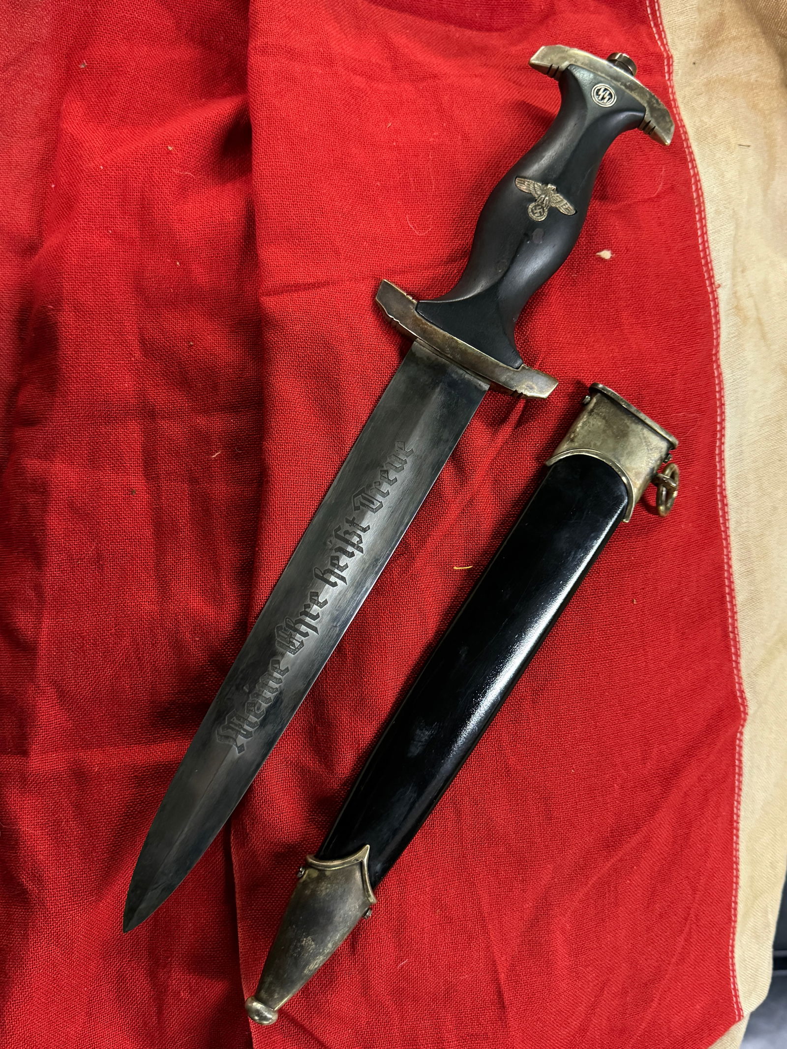 WW2 GERMAN WAFFEN SS DAGGER WITH SCABBARD "MEINE EHRE HEIBT TREUE": WW2 GERMAN WAFFEN SS DAGGER WITH SCABBARD "MEINE EHRE HEIBT TREUE" ETCHED ON THE BLADE. MAKER MARKED AND MADE BY BOKER. SHOWS GOOD WEAR AND USE WITH A BEAUTIFUL OVERALL PATINA. PLEASE VIEW ALL DETAILE