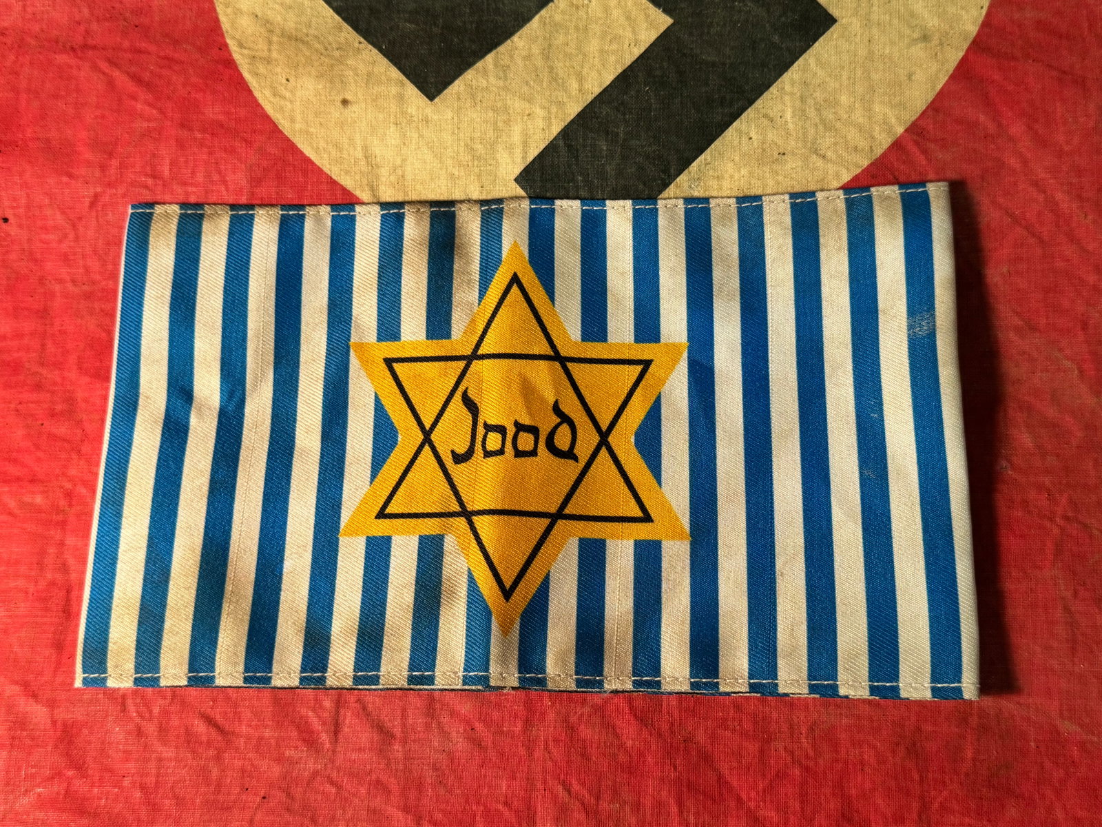 SCARCE WW2 GERMAN CONCENTRATION CAMP JOOD STAR OF DAVID ARMBAND: SCARCE WW2 GERMAN CONCENTRATION CAMP JOOD STAR OF DAVID ARMBAND. A SCARCE FIND. SHOWS GOOD WEAR AND USE WITH A BEAUTIFUL OVERALL PATINA. PLEASE VIEW ALL DETAILED PICTURES. A WELL MADE ANTIQUE GERMAN A