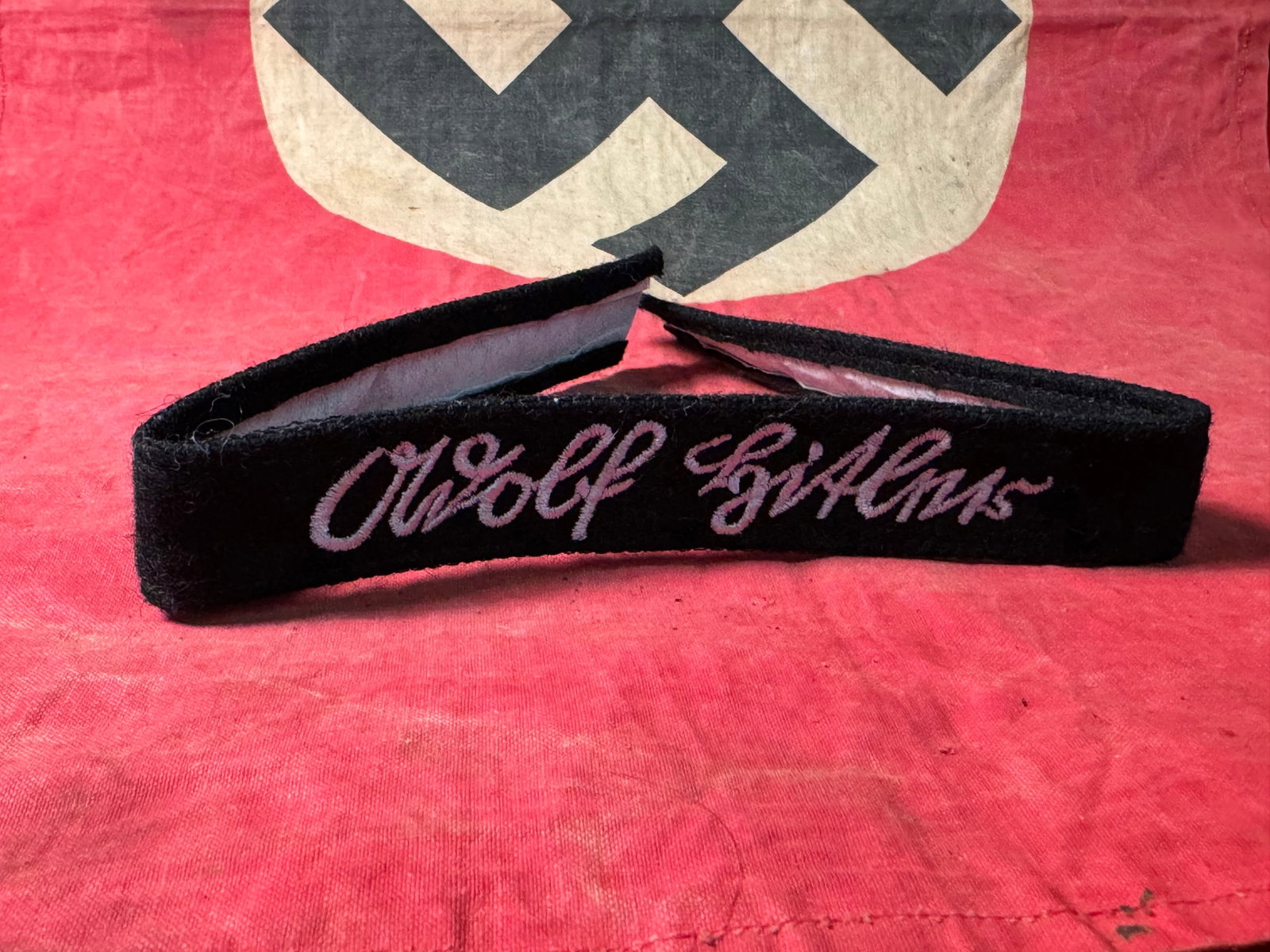 SCARCE WW2 GERMAN ADOLF HITLER CUFF TITLE: SCARCE WW2 GERMAN ADOLF HITLER CUFF TITLE. A SCARCE FIND. SHOWS GOOD WEAR AND USE WITH A BEAUTIFUL OVERALL PATINA. PLEASE VIEW ALL DETAILED PICTURES. A WELL MADE ANTIQUE GERMAN ARTIFACT.