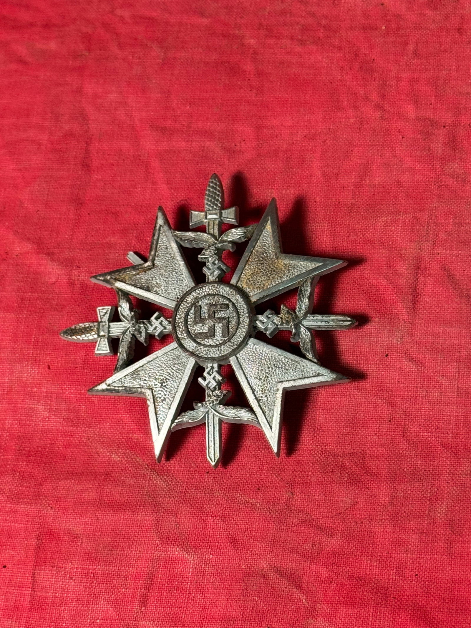 WW2 GERMAN SPANISH CROSS IN SILVER WITH SWORDS: WW2 GERMAN SPANISH CROSS IN SILVER WITH SWORDS. A SCARCE EXAMPLE. SHOWS GOOD WEAR AND USE WITH A BEAUTIFUL OVERALL PATINA. PLEASE VIEW ALL DETAILED PICTURES. A WELL MADE ANTIQUE GERMAN ARTIFACT.