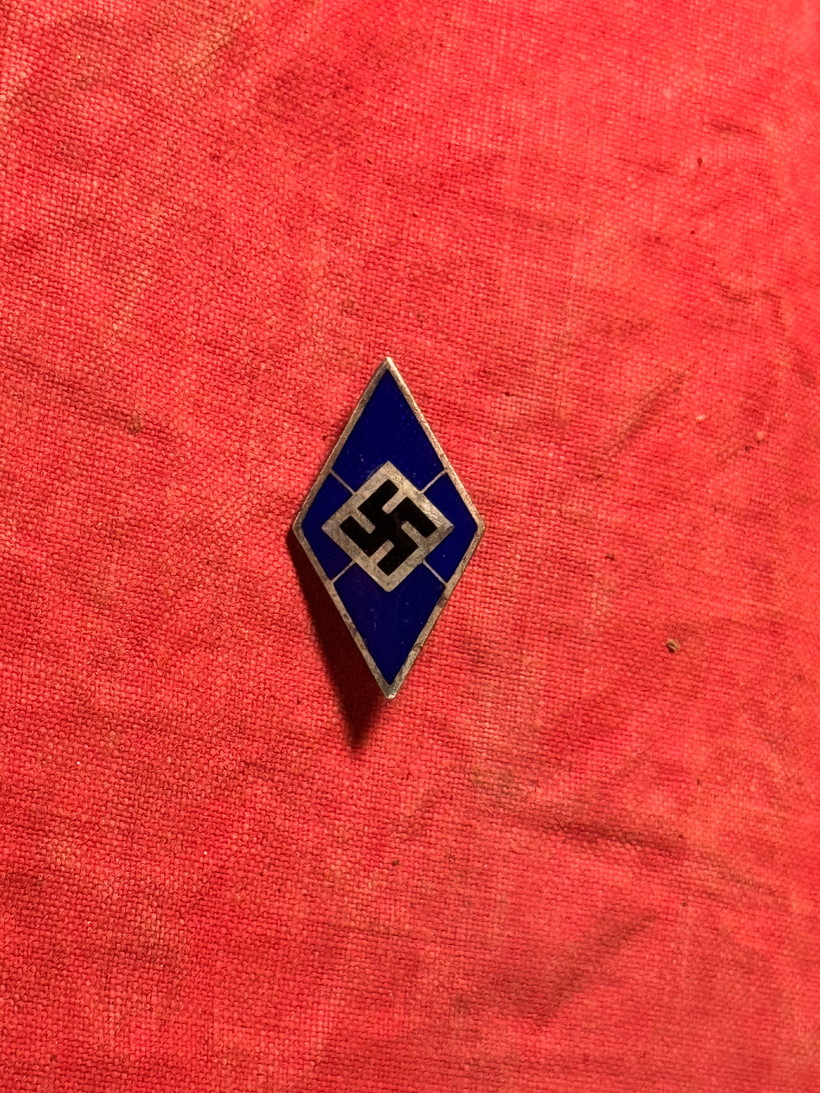 RARE WW2 GERMAN HITLER YOUTH BLUE DIAMOND LAPEL PIN BY GES. GESCH.: RARE WW2 GERMAN HITLER YOUTH BLUE DIAMOND LAPEL PIN BY GES. GESCH. A SCARCE FIND. SHOWS GOOD WEAR AND USE WITH A BEUATIFUL OVERALL PATINA. PLEASE VIEW ALL DETAILED PICTURES. A WELL MADE ANTIQUE GERMAN