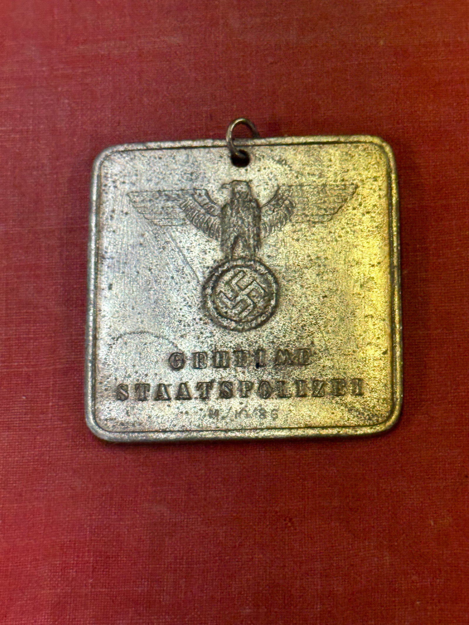 RARE WW2 GERMAN SECRET POLICE ID BADGE NUMBERED 4774: RARE WW2 GERMAN SECRET POLICE ID BADGE NUMBERED 4774. A RARE FIND. SHOWS GOOD WEAR AND USE WITH A BEAUTIFUL OVERALL PATINA. PLEASE VIEW ALL DETAILED PICTURES. A WELL MADE ANTIQUE GERMAN ARTIFACT.