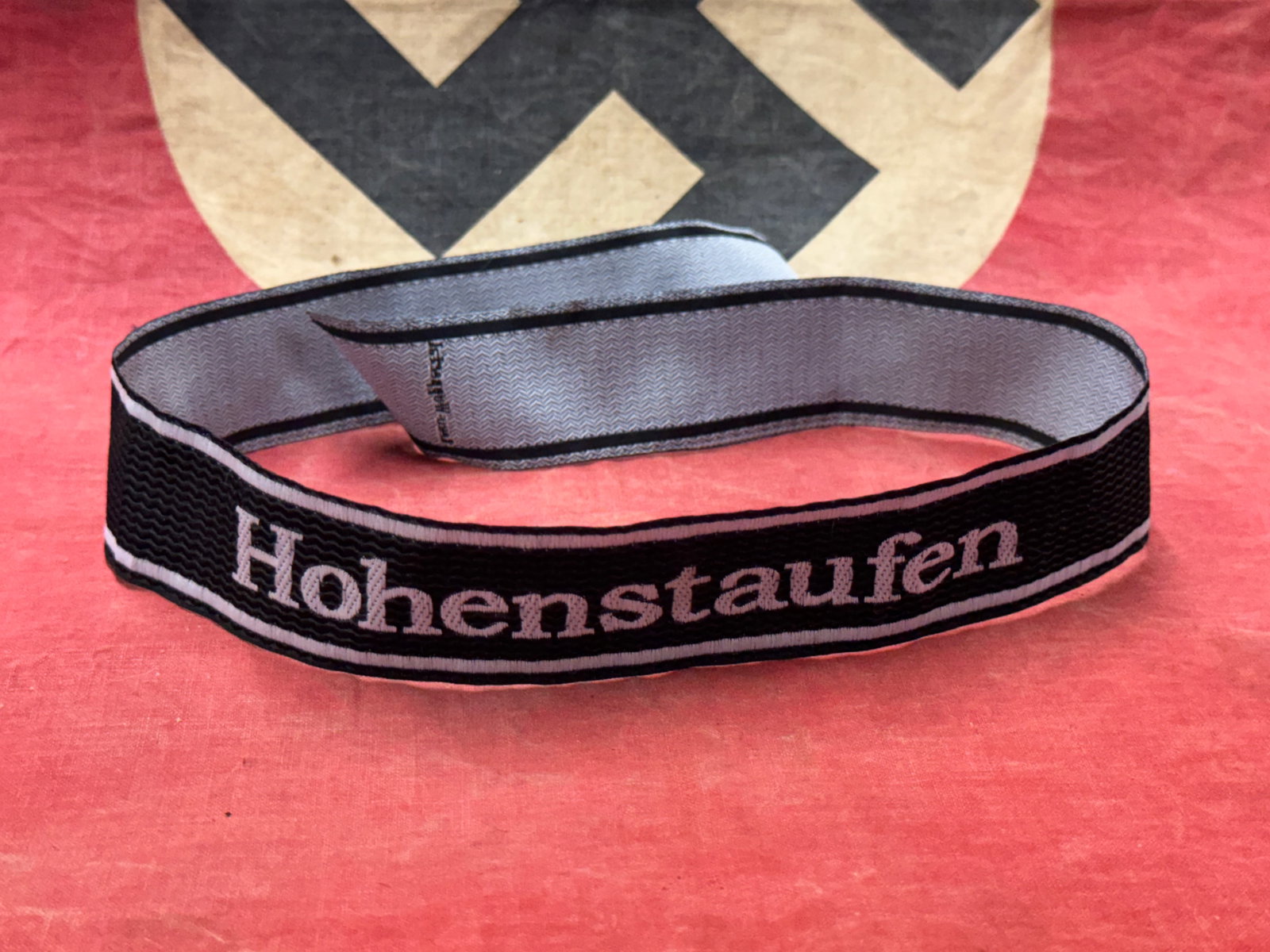 WW2 German Waffen SS "Hohenstaufen" Soldier Brassard Cuff Title: WW2 German Waffen SS "Hohenstaufen" Soldier Brassard Cuff Title. A rare example. Shows good wear and use with a beautiful overall patina. Please view all detailed pictures. A well made antique German 