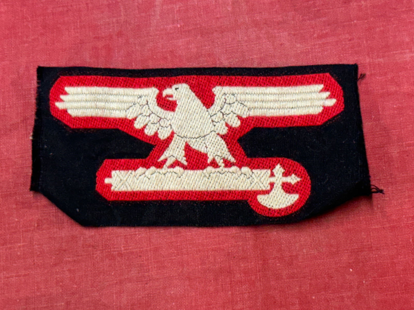 German Italian World War II Waffen Elite Enlisted Mans Arm Eagle: German Italian World War II Waffen Elite Enlisted Mans Arm Eagle. Measures 3 5/8” wide by 1 15/16” tall. The front shows a spread winged eagle standing on an Italian fascist staff with an