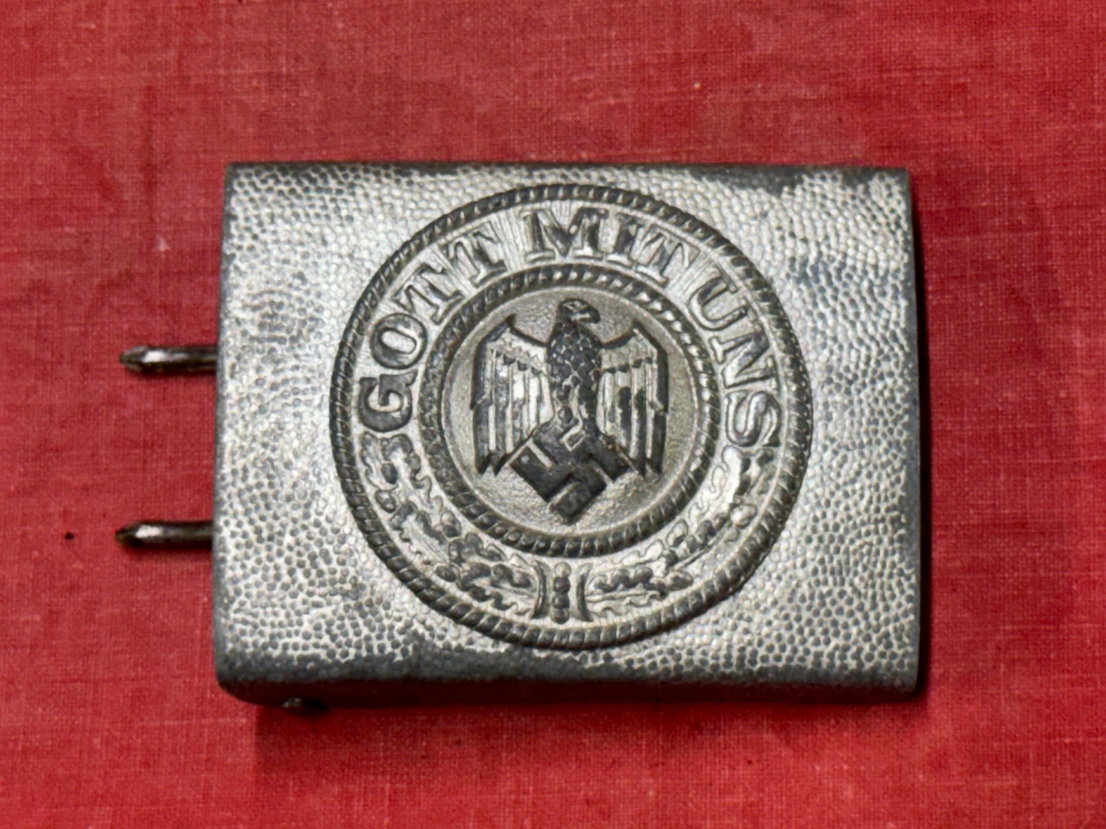 German WWII Heer Steel Buckle: German WWII Heer Steel Buckle. A Heer mid to late war steel belt buckle that has majority of the original factory paint on the outside and retains most of the factory paint on the inside. Used, but in