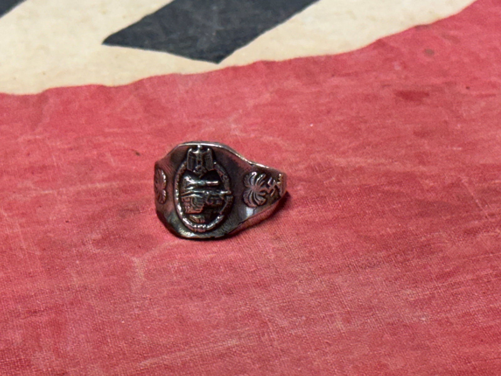 WW2 GERMAN AFRIKA KORPS SS TANKER PERONAL RING IN SILVER: WW2 GERMAN AFRIKA KORPS SS TANKER PERONAL RING IN SILVER. A VERY RARE FIND. SHOWS GOOD WEAR AND USE WITH A BEAUTIFUL OVERALL PATINA. PLEASE VIEW ALL DETAILED PICTURES. A WELL WORN EXAMPLE.