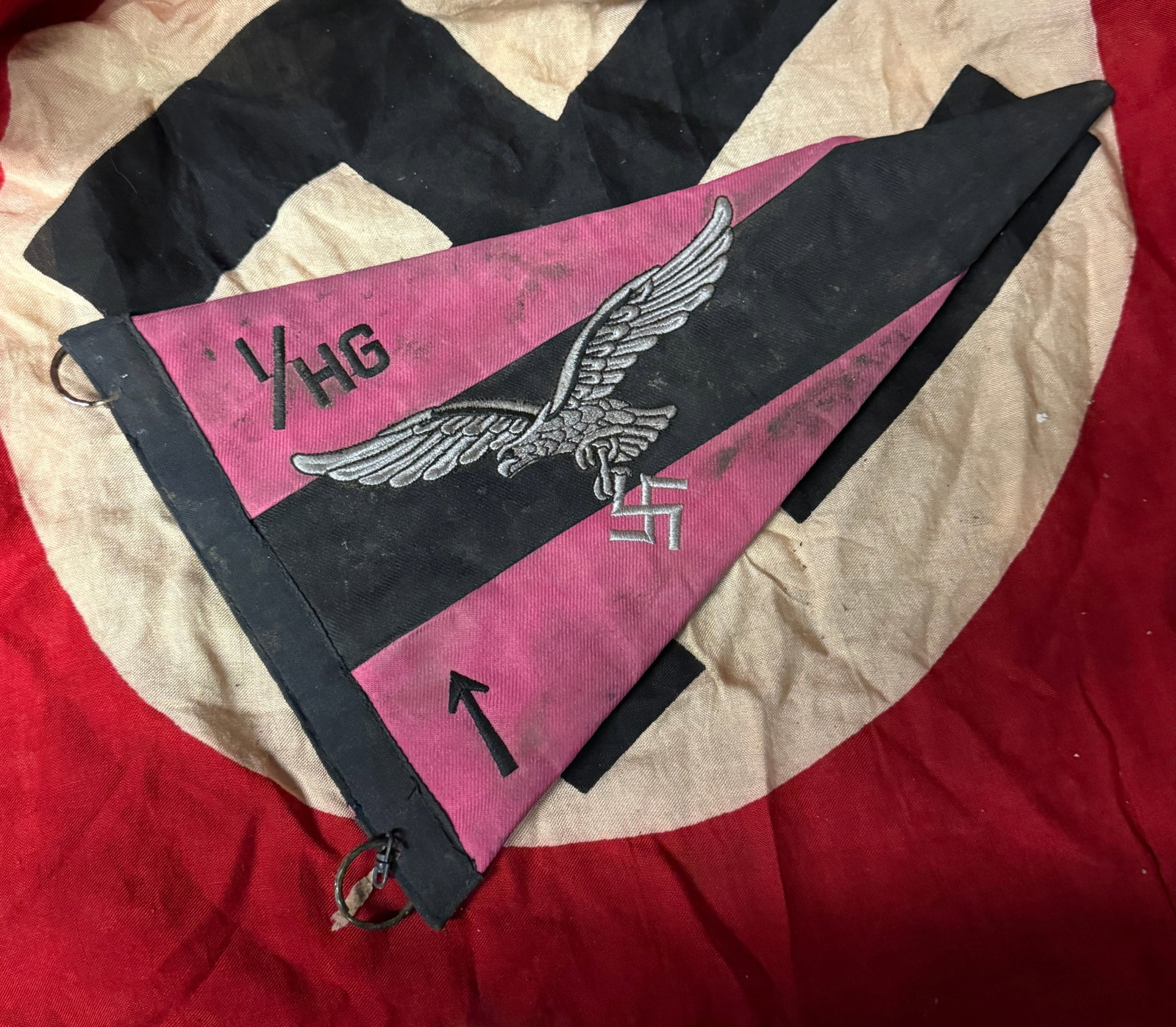 WWII GERMAN THIRD REICH HERMANN GOERING LUFTWAFFE PENNANT FLAG: WWII GERMAN THIRD REICH HERMANN GOERING LUFTWAFFE PENNANT FLAG. A VERY SCARCE FIND. SHOWS GOOD WEAR AND USE WITH A BEAUTIFUL OVERALL PATINA. MEASURES 6.5 X 13 INCHES. PLEASE VIEW ALL DETAILED PICTURES