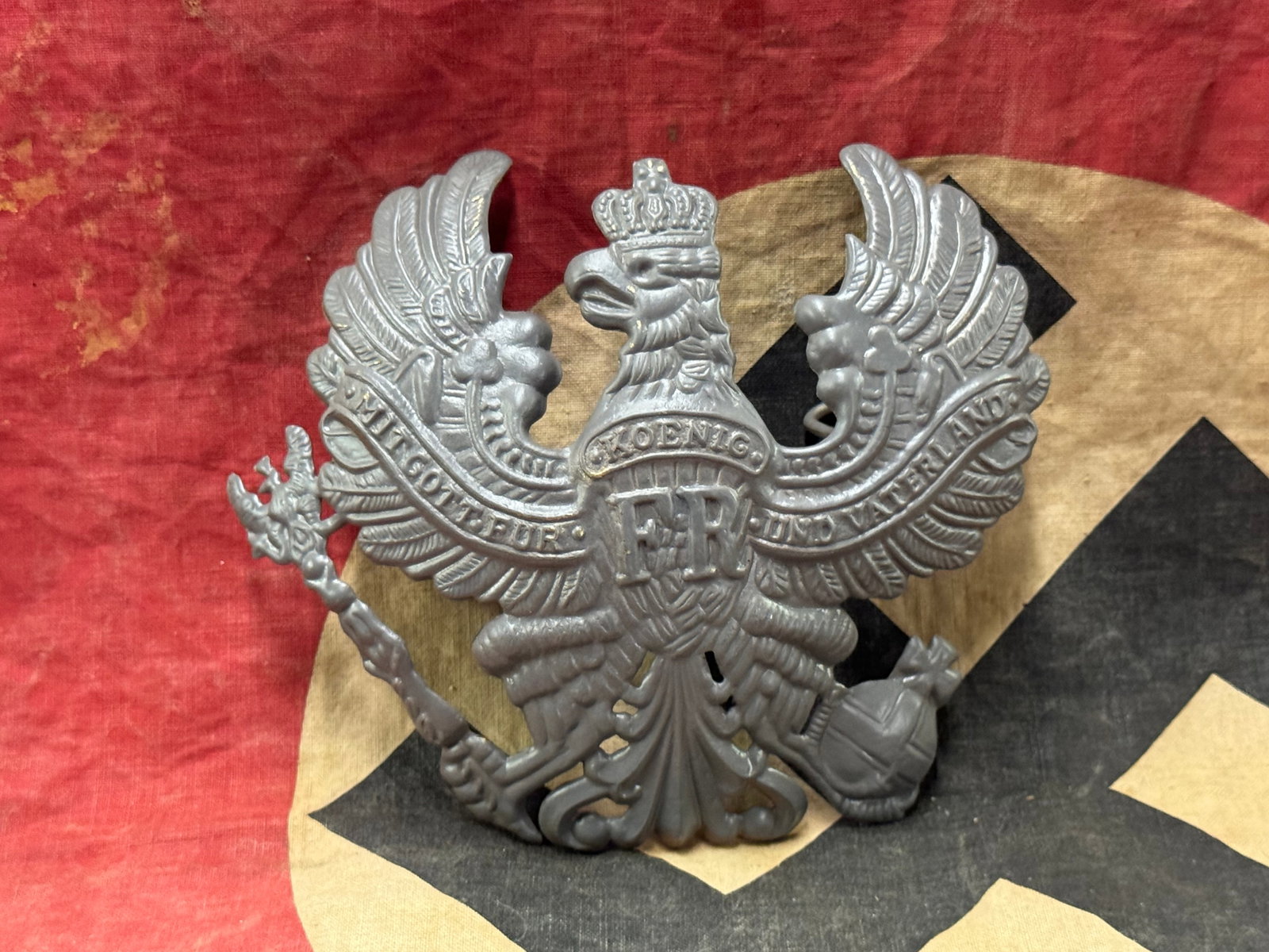 WWI M1916 Prussian Pickelhaube Eagle Helmet Plate In Stamped Steel: WWI M1916 Prussian Pickelhaube Eagle Helmet Plate In Stamped Steel. A rare example. Shows good wear and use with a beautiful overall patina. Please view all detailed pictures. A scarce example.