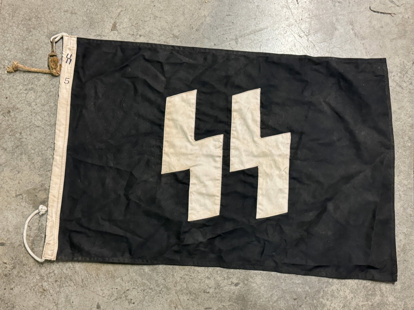 RARE WW2 GERMAN WAFFEN SS FLAG: RARE WW2 GERMAN WAFFEN SS FLAG. A VERY RARE FIND WITH FEW ATTACHEMENTS STILL REMAIN. SHOWS EXCESSIVE WEAR AND USE. PLEASE VIEW ALL DETAILED PICTURES. A VERY RARE FIND.