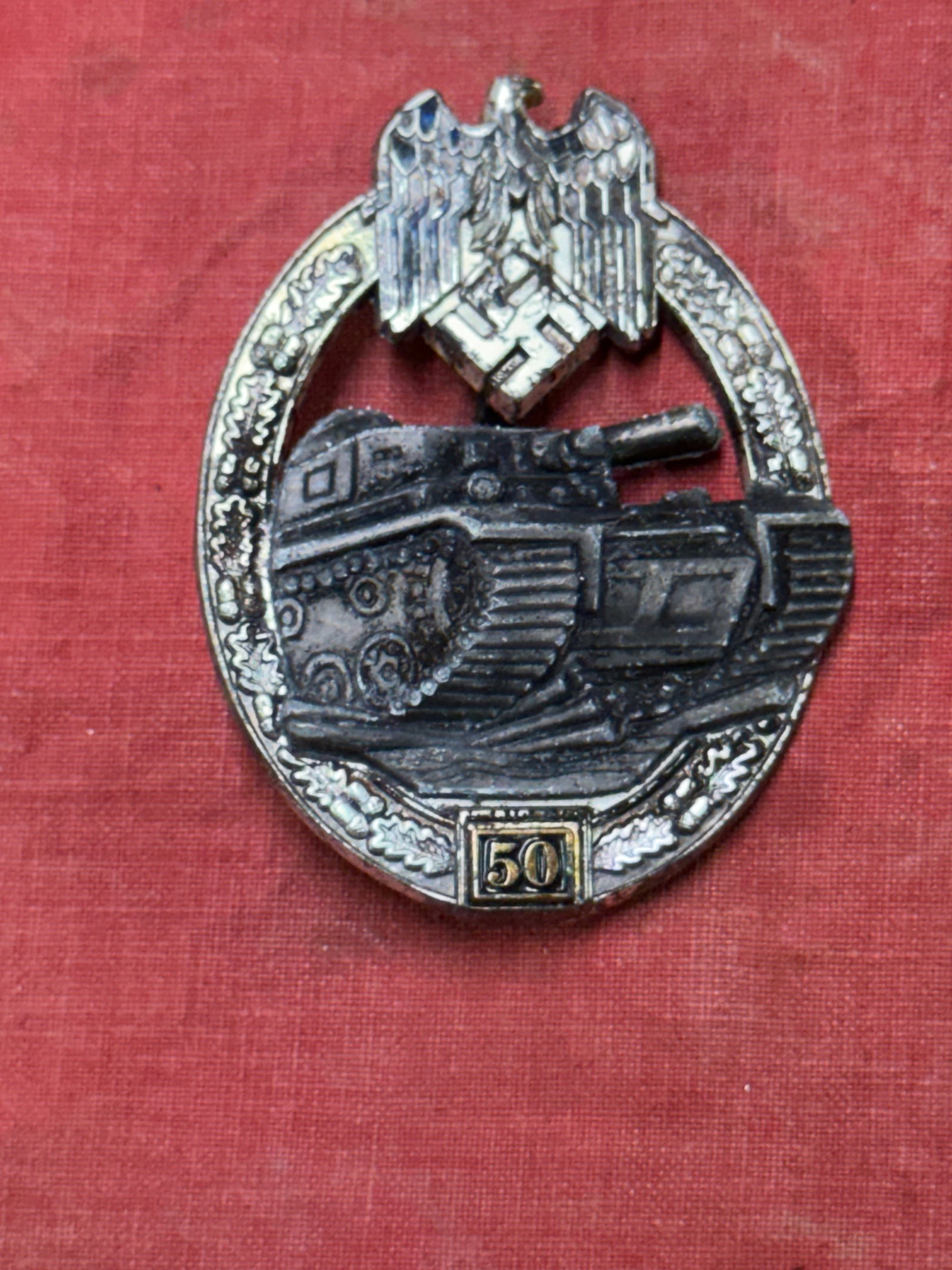WW2 GERMAN PANZER ASSAULT TANK BADGE FOR 50 ENGAGEMENTS: WW2 GERMAN PANZER ASSAULT TANK BADGE FOR 50 ENGAGEMENTS. A SCARCE EXAMPLE. SHOWS GOOD WEAR AND USE WITH A BEAUTIFUL OVERALL PATINA. MAKER MARKED JFS ON THE REVERSE. PLEASE VIEW ALL DETAILED PICTURES. 