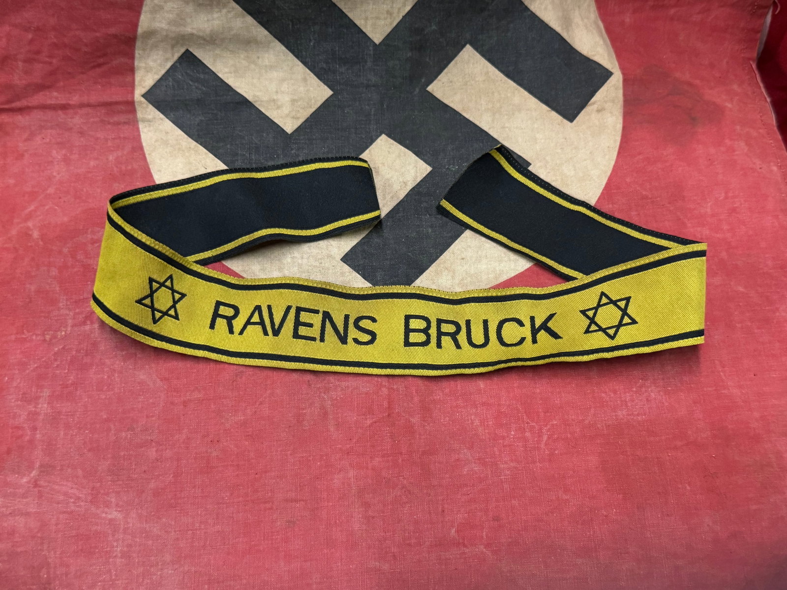 WW2 GERMAN RAVENS BRUCK STAR OF DAVID CUFF TITLE: WW2 GERMAN RAVENS BRUCK STAR OF DAVID CUFF TITLE. A SCARCE EXAMPLE. SHOWS GOOD WEAR AND USE WITH A BEAUTIFUL OVERALL PATINA. PLEASE VIEW ALL DETAILED PICTURES. A SCARCE EXAMPLE.