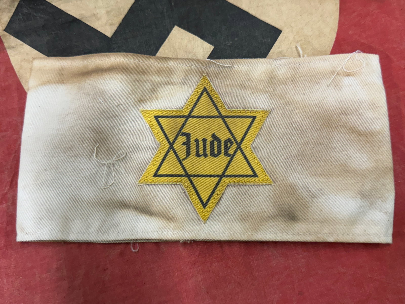 WW2 GERMAN JUDE STAR OF DAVID ARMBAND: WW2 GERMAN JUDE STAR OF DAVID ARMBAND. A SCARCE EXAPLE. SHOWS GOOD WEAR AND USE WITH A BEAUTIFUL OVERALL PATINA. PLEASE VIEW ALL DETAILED PICTURES. A SCARE EXAMPLE.