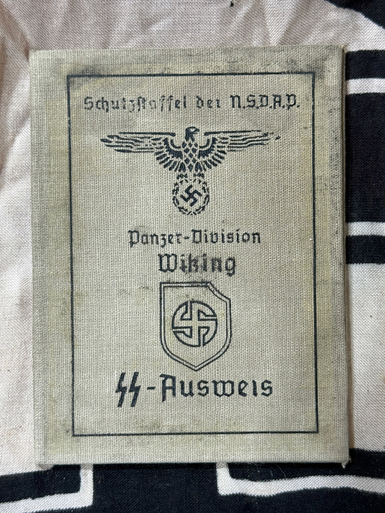 WW2 GERMAN WAFFEN-SS AUSWEIS CAMP OFFICER ID BOOKLET WITH INSPECTION STAMP: WW2 GERMAN WAFFEN-SS AUSWEIS CAMP OFFICER ID BOOKLET WITH INSPECTION STAMP. A VERY RARE FIND. SHOWS GOOD WEAR AND USE WITH A BEAUTIFUL OVERALL PATINA. PLEASE VIEW AL DETAILED PICTURES. A VERY RARE EXA