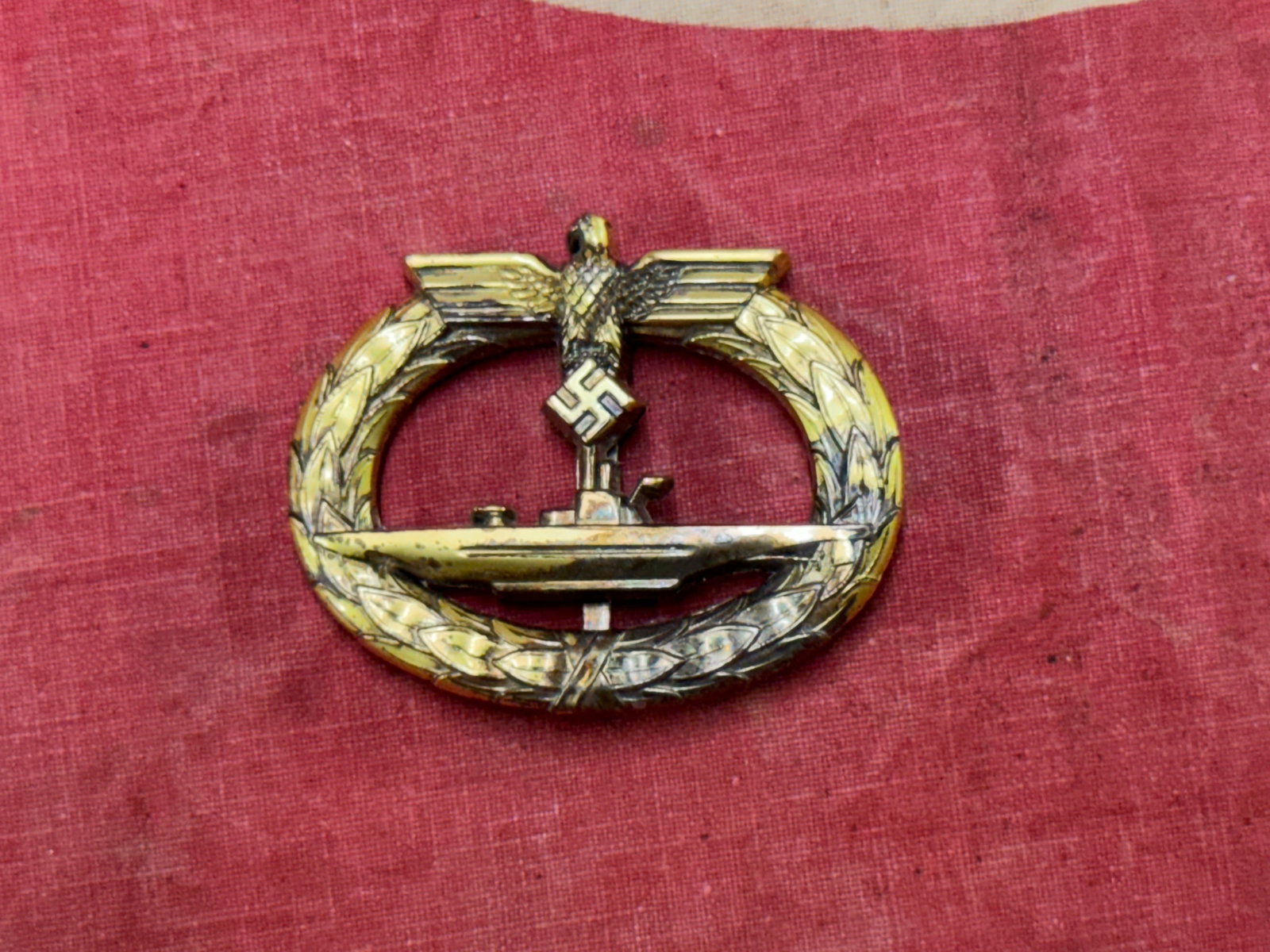WW2 GERMAN KRIEGSMARINE U-BOAT BADGE BY SCHWERIN BERLIN 68: WW2 GERMAN KRIEGSMARINE U-BOAT BADGE BY SCHWERIN BERLIN 68. A RARE EXAMPLE. SHOWS GOOD WEAR AND USE WITH A BEAUTIFUL OVERALL PATINA. PLEASE VIEW ALL DETAILED PICTURES. A SCARCE EXAMPLE.