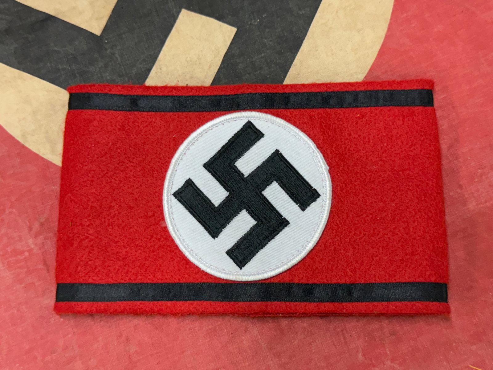 GERMAN WW2 SS OFFICER ARMBAND IN WOOL: GERMAN WW2 SS OFFICER ARMBAND IN WOOL. A RARE FIND. SHOWS GOOD WEAR AND USE WITH A BEAUTIFUL OVERALL PATINA. PLEASE VIEW ALL DETAILED PICTURES. A SCARCE EXAMPLE.