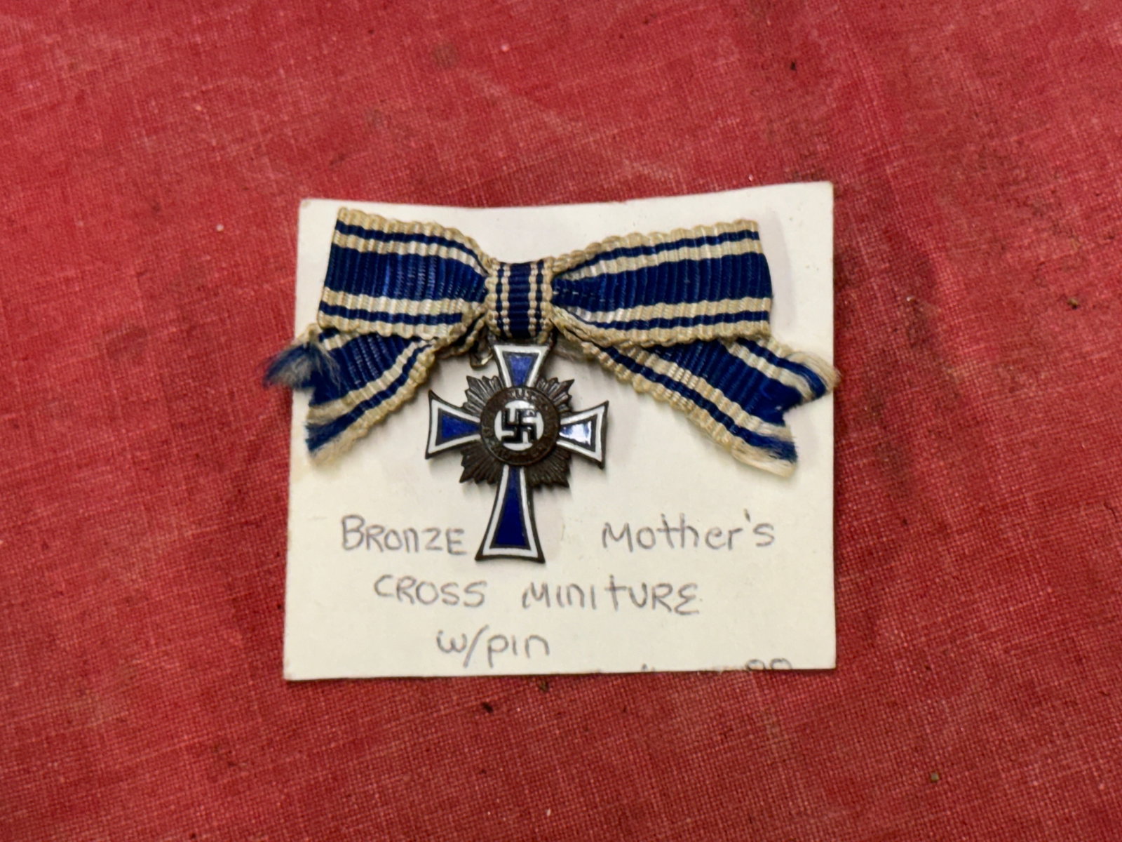 RARE WW2 GERMAN MOTHER'S CROSS MINIATURE IN BRONZE WITH PIN: RARE WW2 GERMAN MOTHER'S CROSS MINIATURE IN BRONZE WITH PIN. A SCARCE FIND. SHOWS GOOD WEAR AND USE WITH A BEAUTIFUL OVERALL PATINA. PLEASE VIEW ALL DETAILED PICTURES. A SCARCE EXAMPLE.