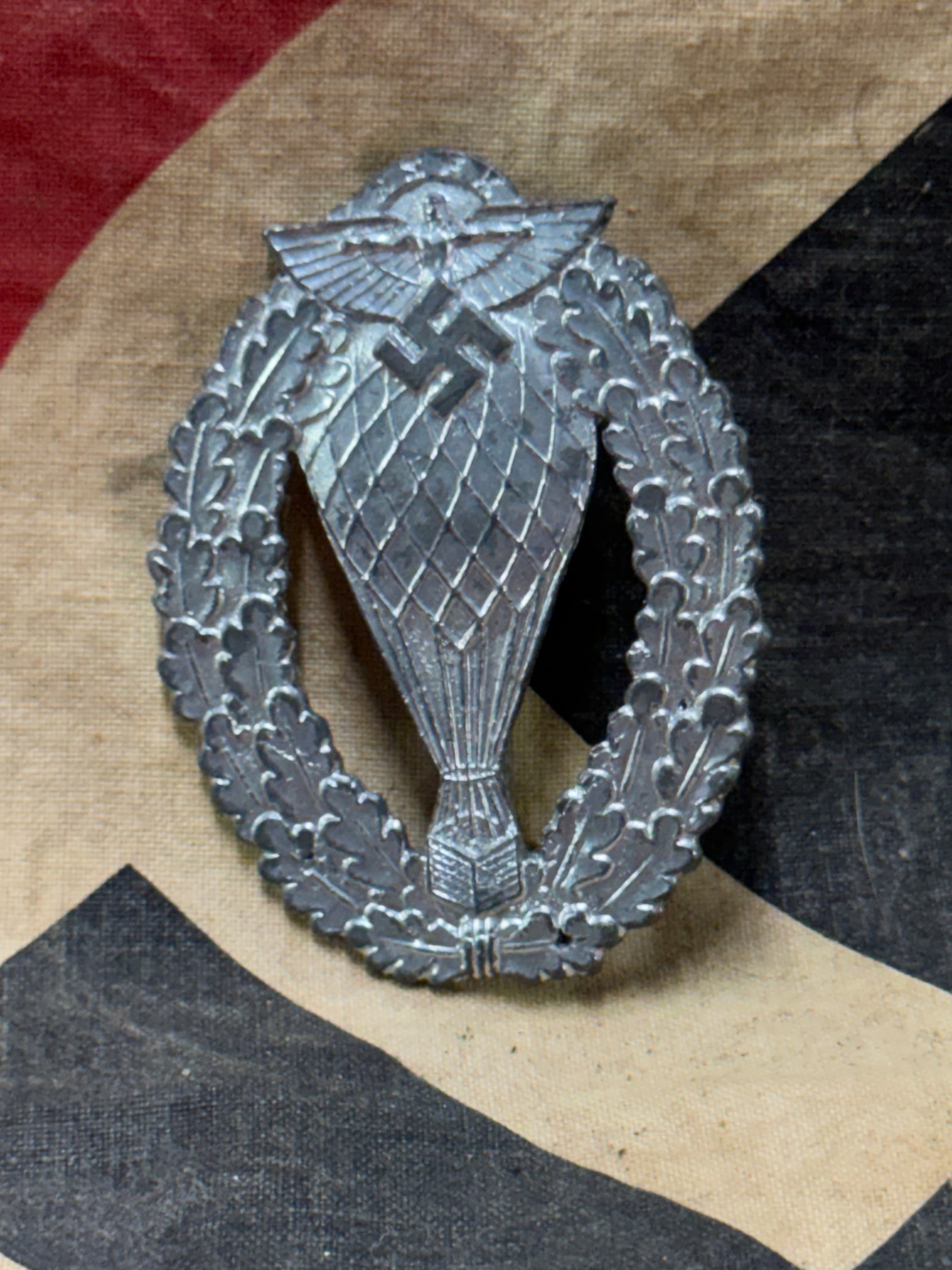 WW2 GERMAN NSFK BALLOON PILOT'S BADGE IN SILVER: WW2 GERMAN NSFK BALLOON PILOT'S BADGE IN SILVER. A RARE FIND. SHOWS GOOD WEAR AND USE WITH A BEAUTIFUL OVERALL PATINA. PLEASE VIEW ALL DETAILED PICTURES.