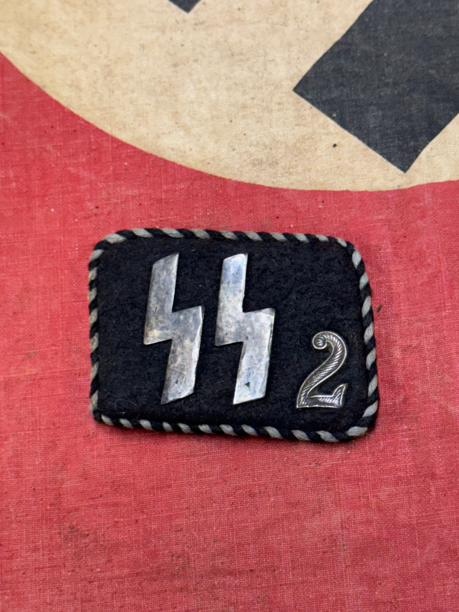 WW2 SS-VT Germania Collar Tab- Bullion: WW2 SS-VT Germania Collar Tab- Bullion example of the Germania SS Tab in bullion. Alternating piping and tight construction, this is a nice tab and you won't be disappointed.