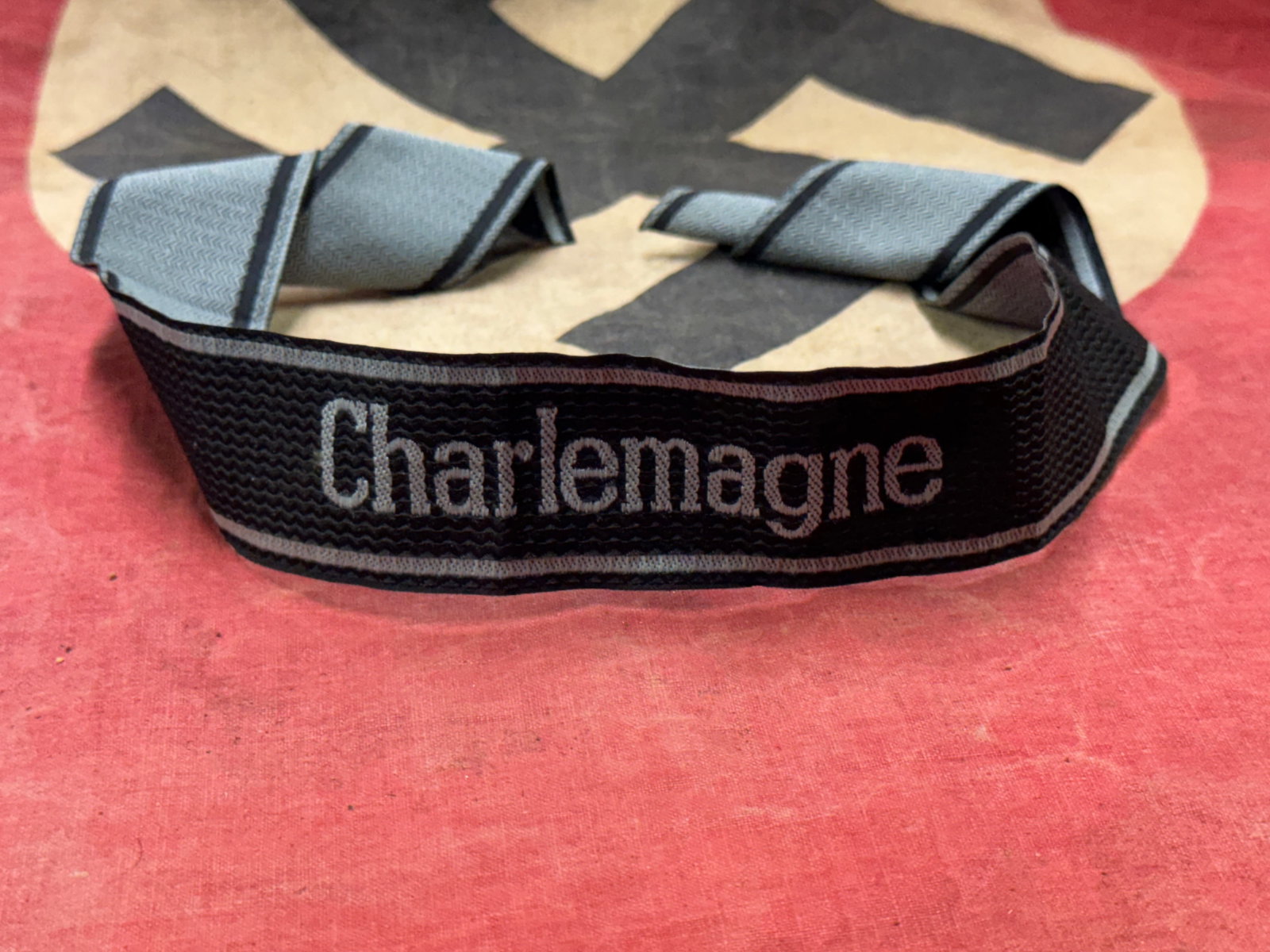 WW2 German SS Officer’s cuff title CHARLEMAGNE: WW2 German SS Officer’s cuff title CHARLEMAGNE. A very rare example. Shows good wear and use with a beautiful overall patina. Please view all detailed pictures. A rare German artifact.