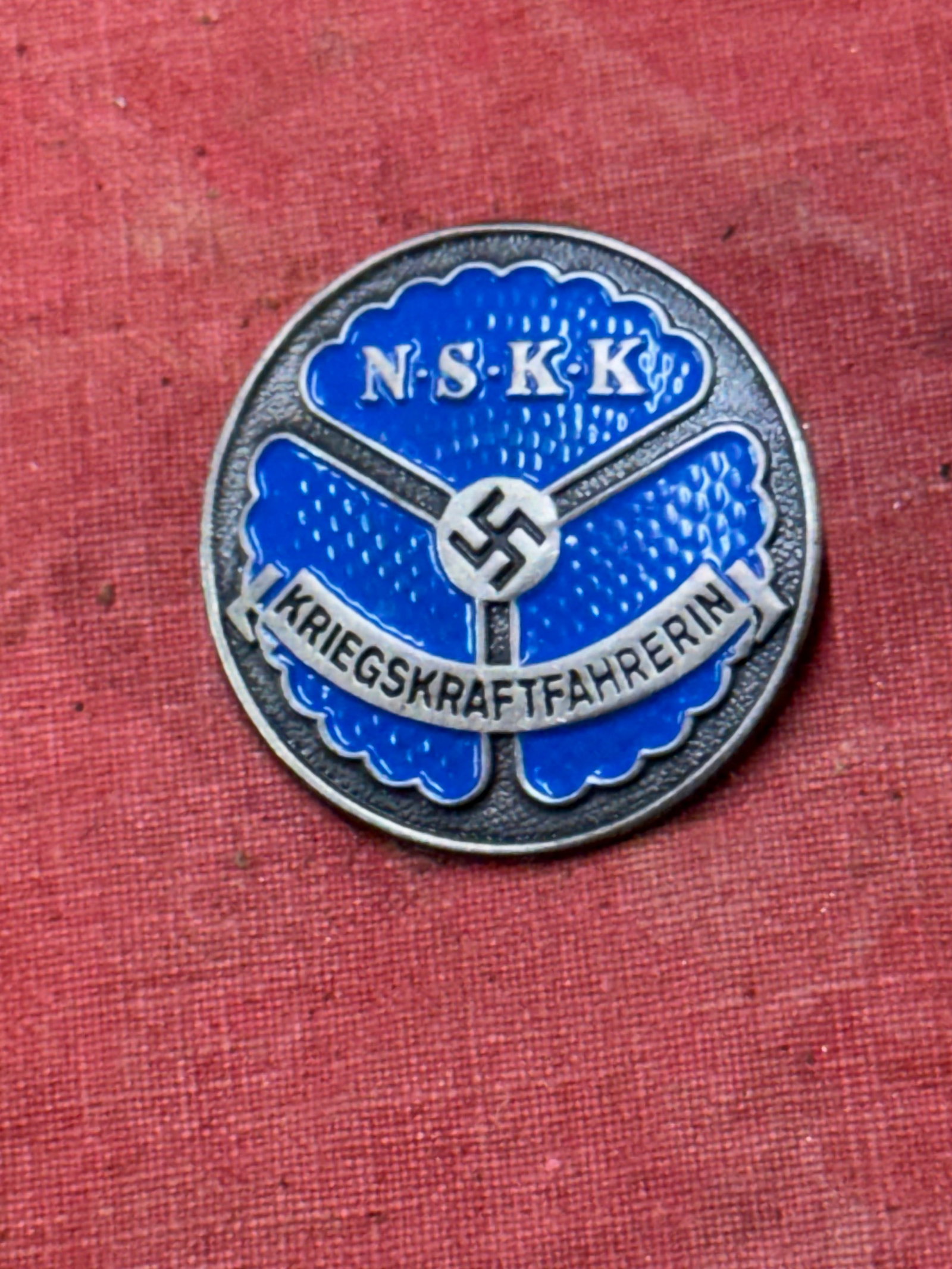 RARE WW2 GERMAN NSKK FEMALE DRIVERS BADGE MARKED RZM M1/35: RARE WW2 GERMAN NSKK FEMALE DRIVERS BADGE MARKED RZM M1/35. A RARE FIND. SHOWS GOOD WEAR AND USE WITH A BEAUTIFUL OVERALL PATINA. PLEASE VIEW ALL DETAILED PICTURES. BEAUTIFULLY ENAMELED IN GOOD SHAPE.