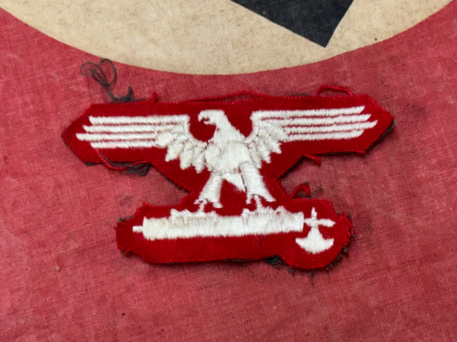 WW2 Germany, SS. A Rare 29th Waffen Grenadier Division of the SS (1st Italian) Sleeve Eagle: WW2 Germany, SS. A Rare 29th Waffen Grenadier Division of the SS (1st Italian) Sleeve Eagle. Constructed of red wool, the obverse bearing a machine-embroidered Italian national eagle clutching a fasce