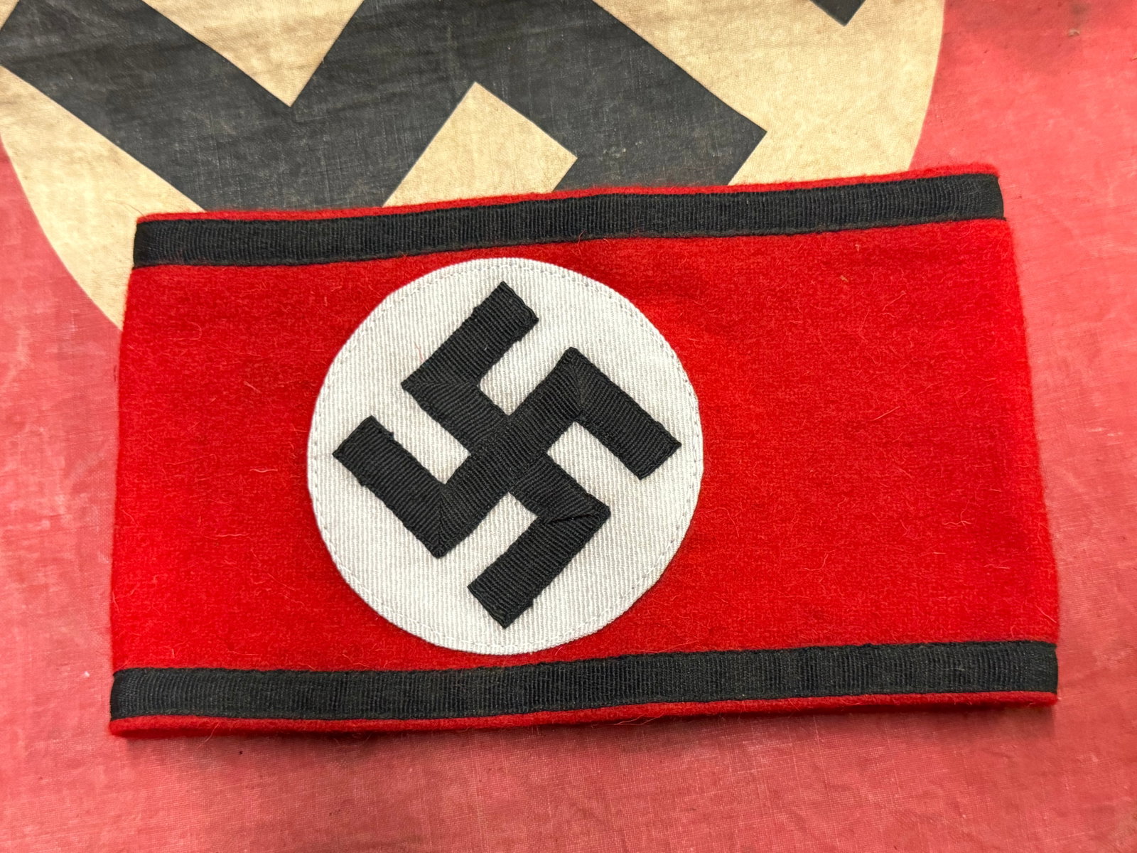 WW2 GERMAN WAFFEN SS OFFICER ARMBAND IN WOOL WITH RZM TAG: WW2 GERMAN WAFFEN SS OFFICER ARMBAND IN WOOL WITH RZM TAG. AN ULTRA RARE FIND. SHOWS GOOD WEAR AND USE WITH A BEAUTIFUL OVERALL PATINA. PLEASE VIEW ALL DETAILED PICTURES. A VERY RARE EXAMPLE.
