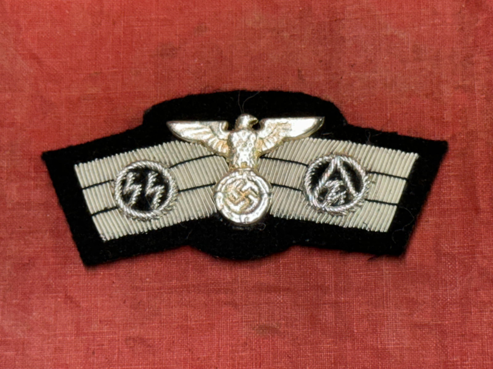 WW2 German Early SS/SA Pilots Badge, Bullion: WW2 German Early SS/SA Pilots Badge, Bullion. Hand embroidered in genuine bullion on quality wool; with excellent detail and top notch workmanship. Shows good wear and use with a beautiful overall pat