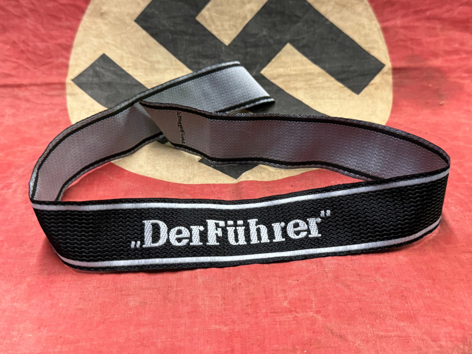 WW2 German Waffen SS DEF FUHRER CUFF TITLE BY BEVO: WW2 German Waffen SS DEF FUHRER CUFF TITLE BY BEVO. A RARE FIND. SHOWS GOOD WEAR AND USE WITH A BEAUTIFUL OVERALL PATINA. PLEASE VIEW ALL DETAILED PICTURES. A SCARCE EXAMPLE.