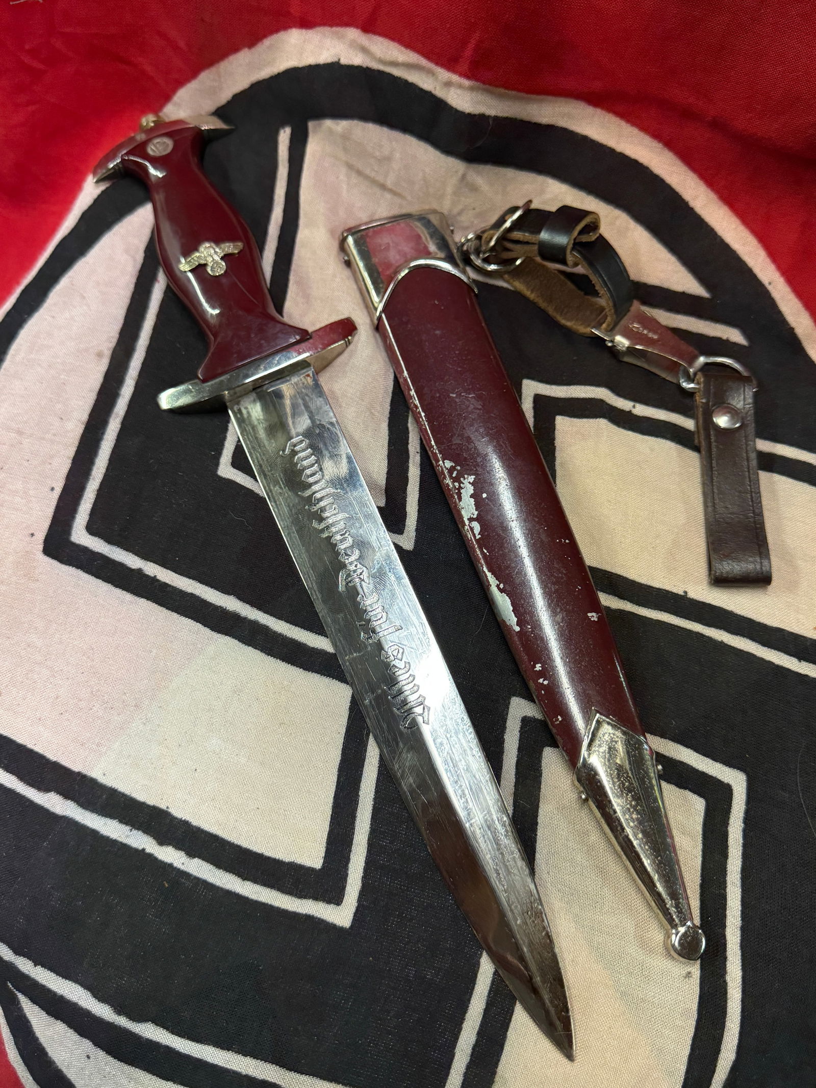 WW2 GERMAN SA "ULLES FUR DEUTSCHLAND" DAGGER WITH SHEATH AND HANGER BY ASSMAN: WW2 GERMAN SA "ULLES FUR DEUTSCHLAND" DAGGER WITH SHEATH AND HANGER BY ASSMAN. A VERY RARE FIND. SHOWS GOOD WEAR AND USE WITH A BEAUTIFUL OVERALL PATINA. PLEASE VIEW ALL DETAILED PICTURES. A VERY RARE