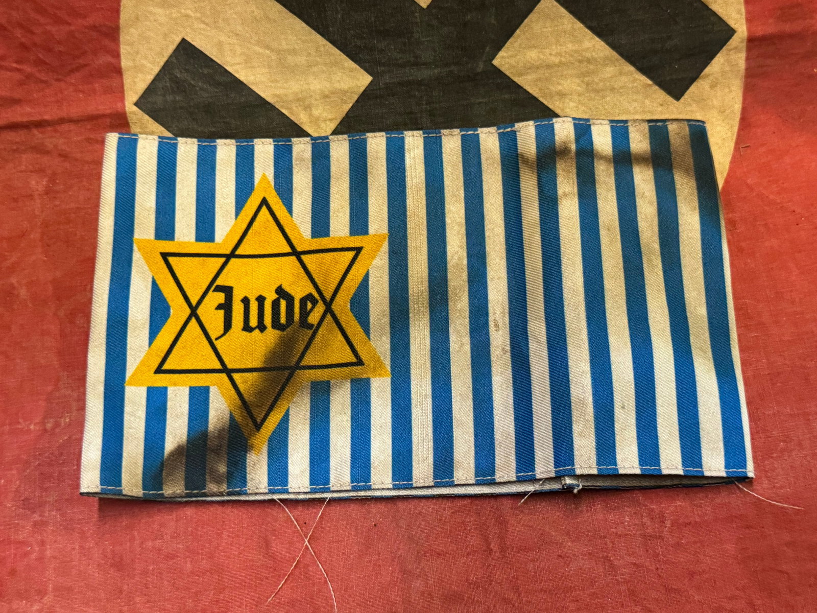 RARE WW2 GERMAN JUDE STAR OF DAVID CONCENTRATION CAMP ARMBAND: RARE WW2 GERMAN JUDE STAR OF DAVID CONCENTRATION CAMP ARMBAND. A VERY RARE EXAMPLE. SHOWS GOOD WEAR AND USE WITH A BEAUTIFUL OVERALL PATINA. PLEASE VIEW ALL DETAILED PICTURES. A SCARCE EXAMPLE.