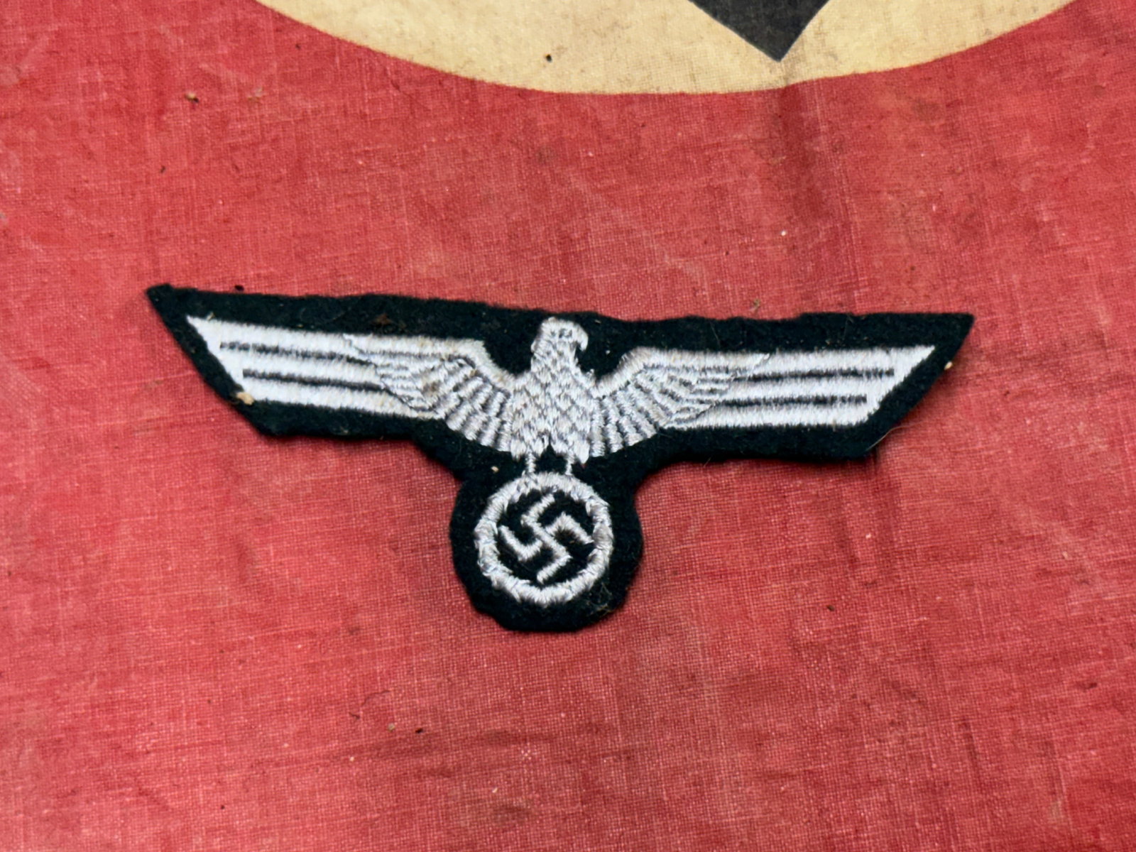 WW2 German Waffen SS Eagle Sleeve Badge Insignia: WW2 German Waffen SS Eagle Sleeve Badge Insignia. A rare find. Shows good wear and use with a beautiful overall patina. Please view all detailed pictures. A scarce example.