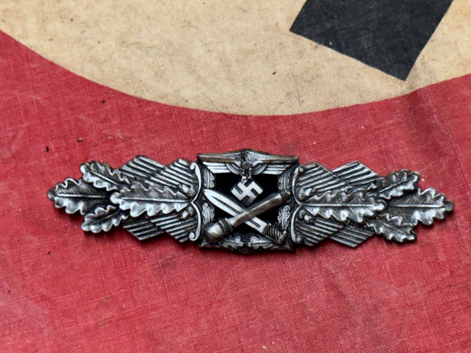 WW2 German Close Combat Clasp Badge - Silver By FLL: WW2 German Close Combat Clasp Badge - Silver By FLL. A rare find. Shows good wear and use with a beautiful overall patina. Please view all detailed pictures. A very scarce example.