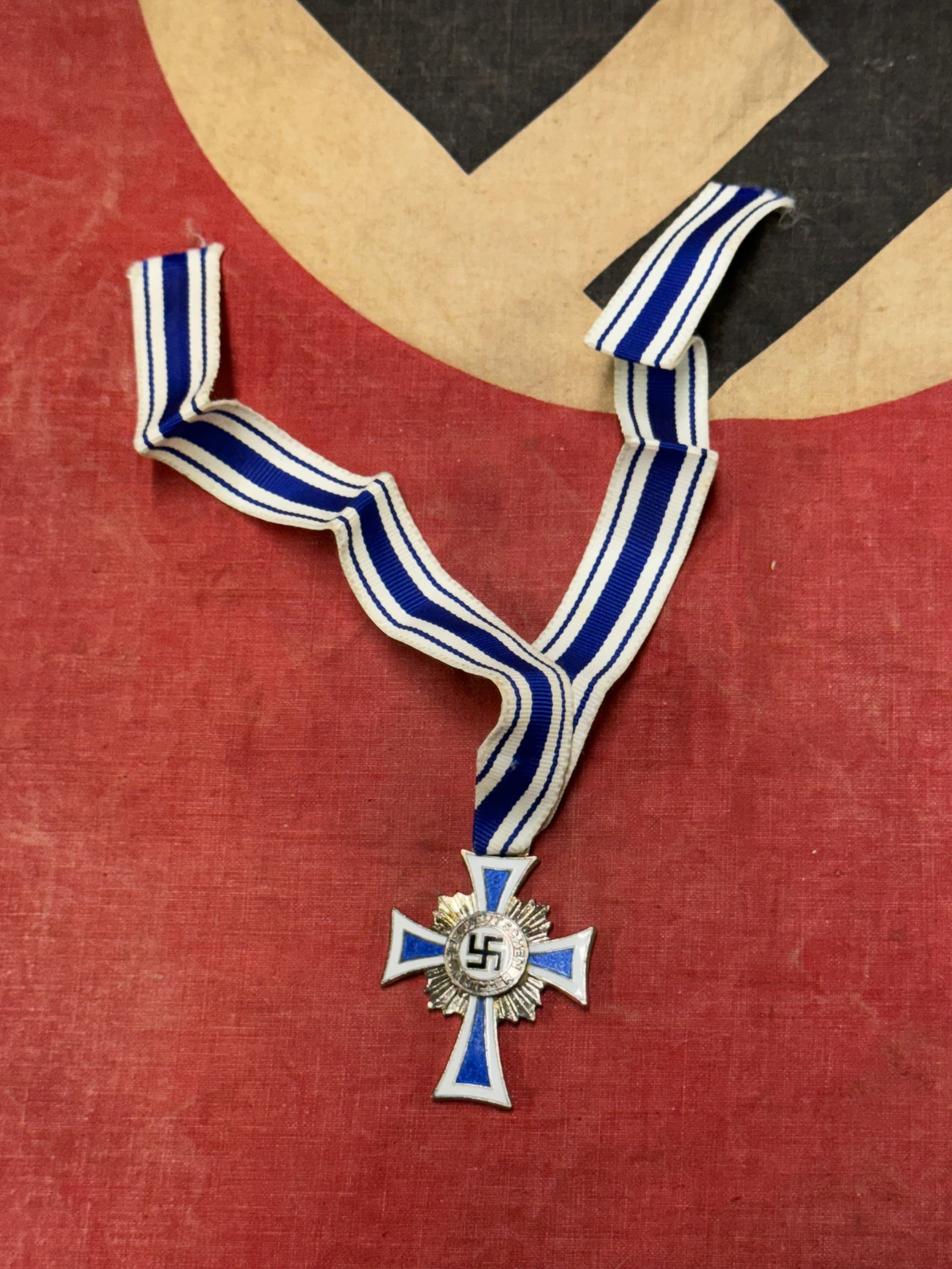 Rare WW2 German Mothers Cross With Ribbon: Rare WW2 German Mothers Cross With Ribbon. Shows good wear and use with a beautiful overall patina. Please view all detailed pictures. A scarce example.