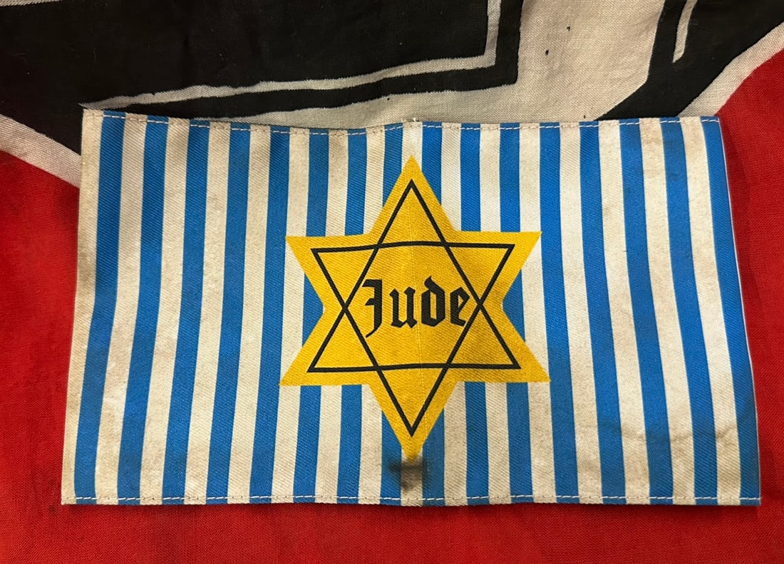 WW2 GERMAN JUDE STAR OF DAVID CONCENTRATION CAMP ARMBAND: WW2 GERMAN JUDE STAR OF DAVID CONCENTRATION CAMP ARMBAND. A VERY SCARCE EXAMPLE. AN ULTRA RARE FIND SHOWING GOOD WEAR AND USE WITH A BEAUTIFUL OVERALL PATINA. PLEASE VIEW ALL DETAILED PICTURES. A VERY