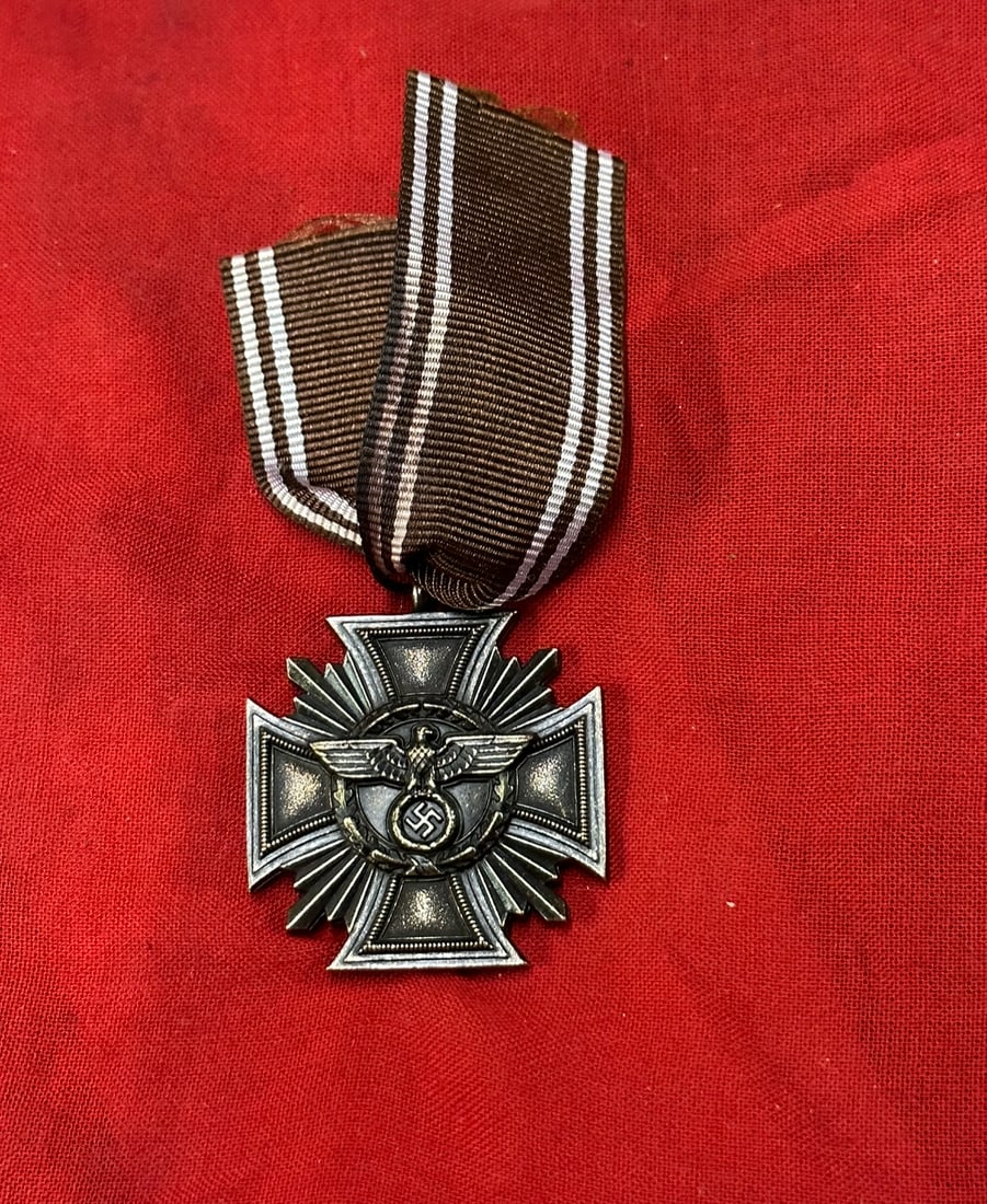WW2 GERMAN NSDAP 10 YEAR LONG SERVICE BRONZE MEDAL: WW2 GERMAN NSDAP 10 YEAR LONG SERVICE BRONZE MEDAL. An original NSDAP 10 Year Long Service Bronze Medal, constructed in zinc with a nice bronze finish, unmarked with a long ribbon with a beautiful pat